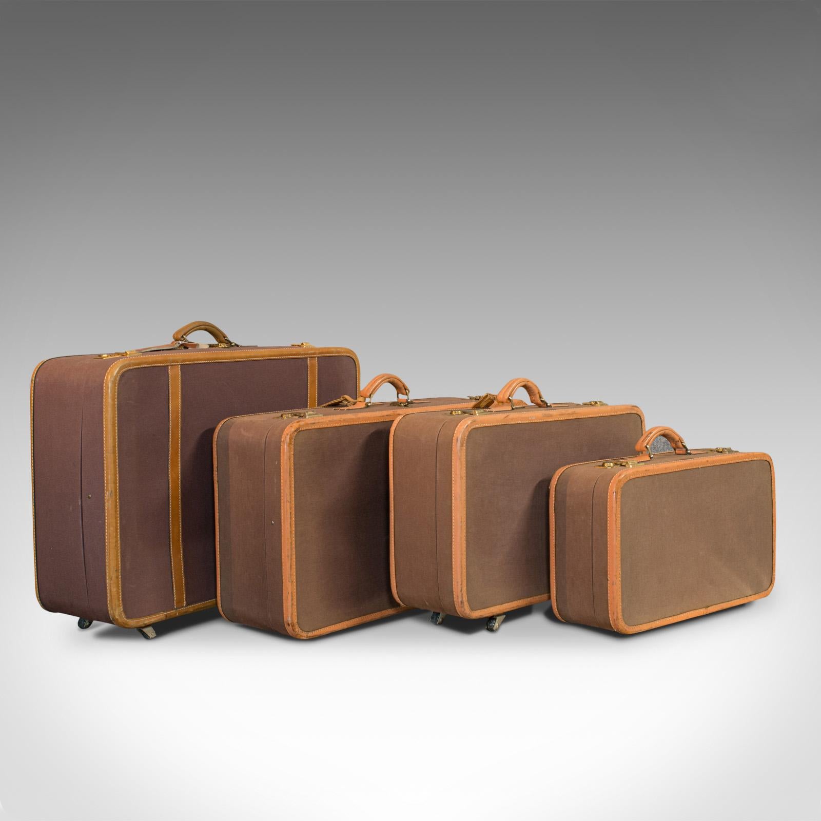 This is a vintage luggage set. An American, leather and canvas set of 4 suitcases by T. Anthony of New York, dating to the late 20th century, circa 1970.

Luxury American cases, favoured by the jet set
Displaying a desirable aged patina
Leather