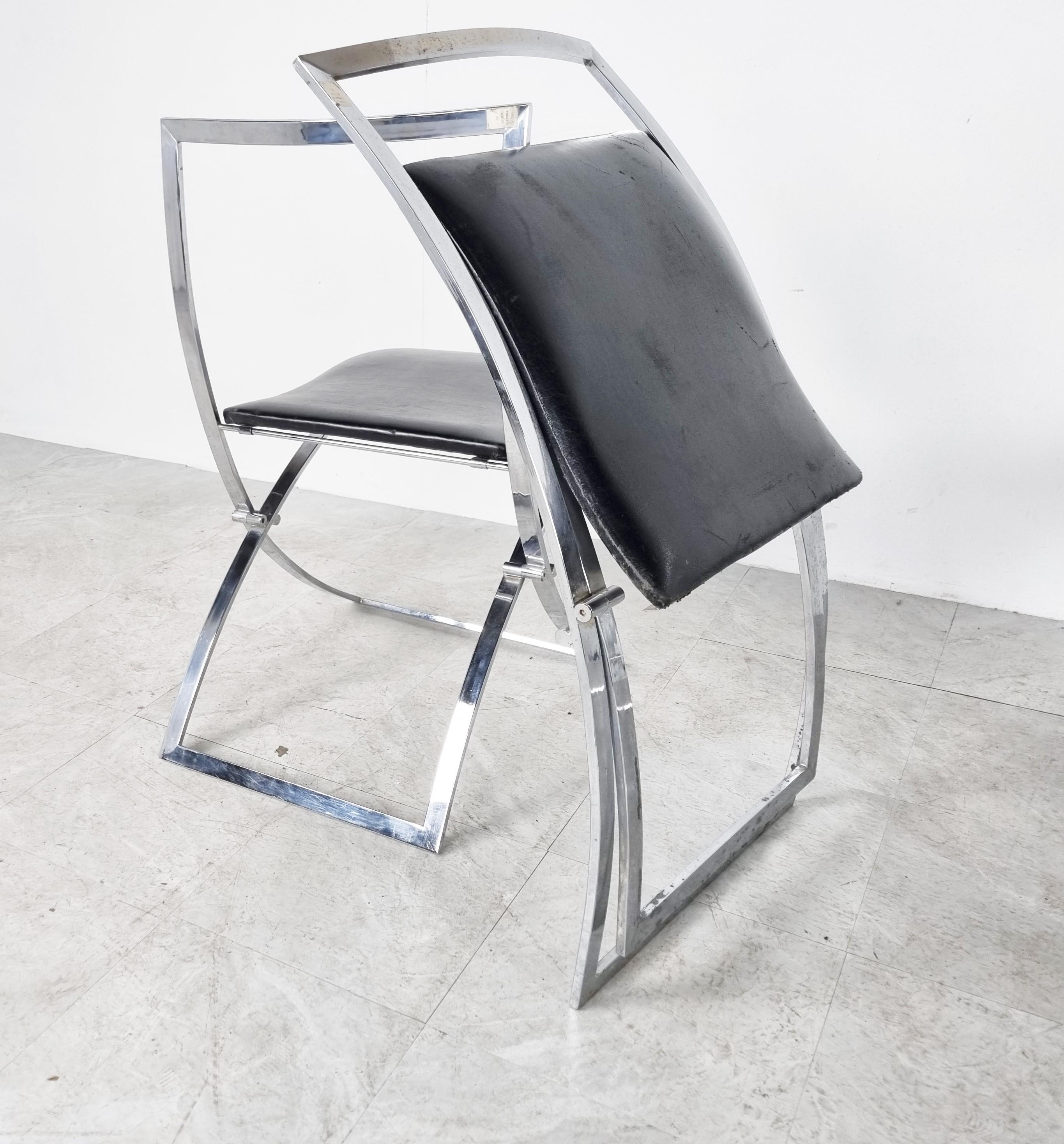 Italian chromed foldable dining chairs designed by Marcello Cuneo for Mobel. Model Luisa

Untouched original condition with normal age related wear. Two chairs have some corrosion marks, but have been polished so it's smooth.
The upholstery of