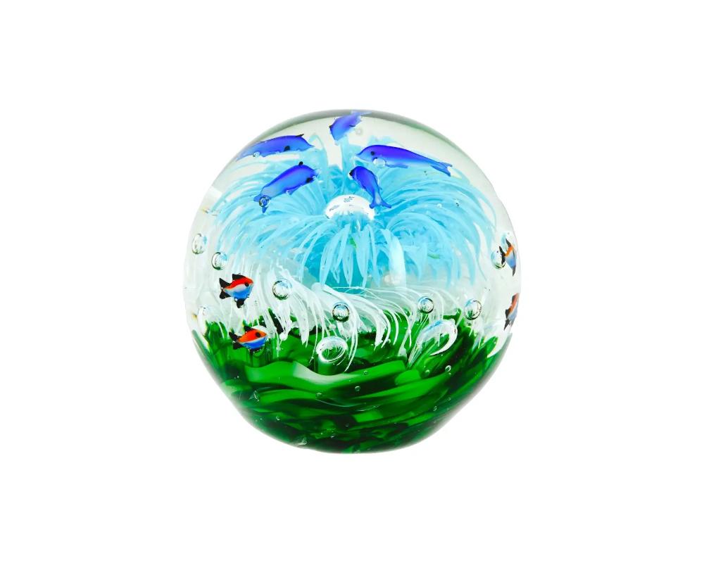 A large vintage hand-blown glass paperweight. The polychrome globe piece represents an aquarium with fish. Collectible Desk Accessories And Home Decor.

OVERALL GOOD VINTAGE CONDITION. SIGNS OF WEAR AND AGE. REFER TO PHOTOS.

OVERALL H 5 1/2 IN. ALL