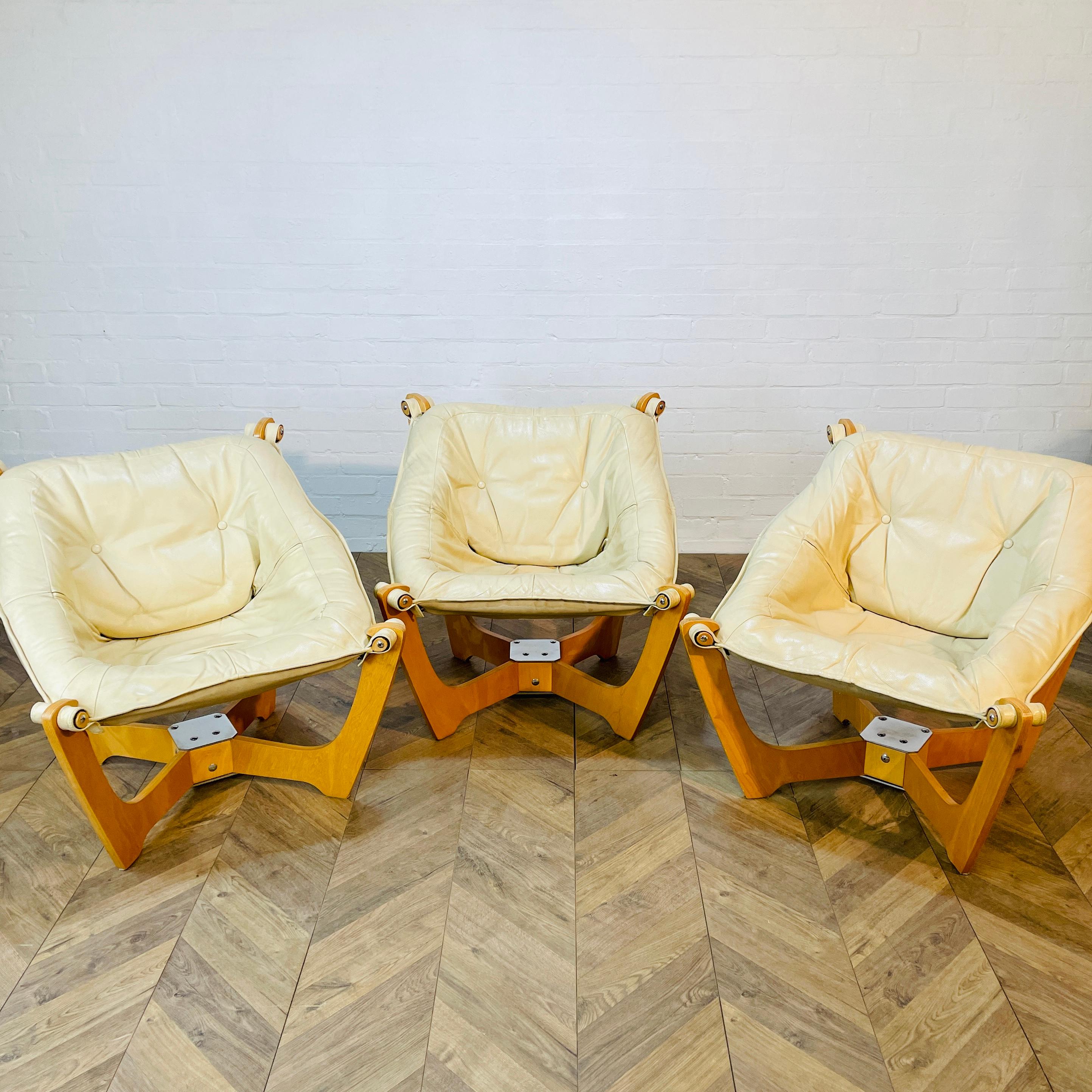 A Stylish Set of 3, Luna Chairs by Norwegian Designer, Odd Knutsen.

Originally designed in the 1970s, production ran through to the 90s.

The chairs, which are super comfortable, are upholstered in beige / cream leather with button detailing and