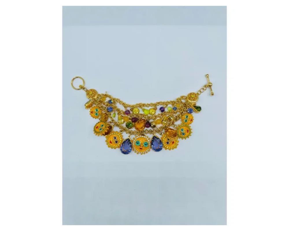 Vintage Lunch at the Ritz Sun Themed Bracelet

In excellent condition

Please see photos for size and condition

Due to the item's age do not expect items to be in perfect condition and I may not describe every little scratch or spot. Please inquire