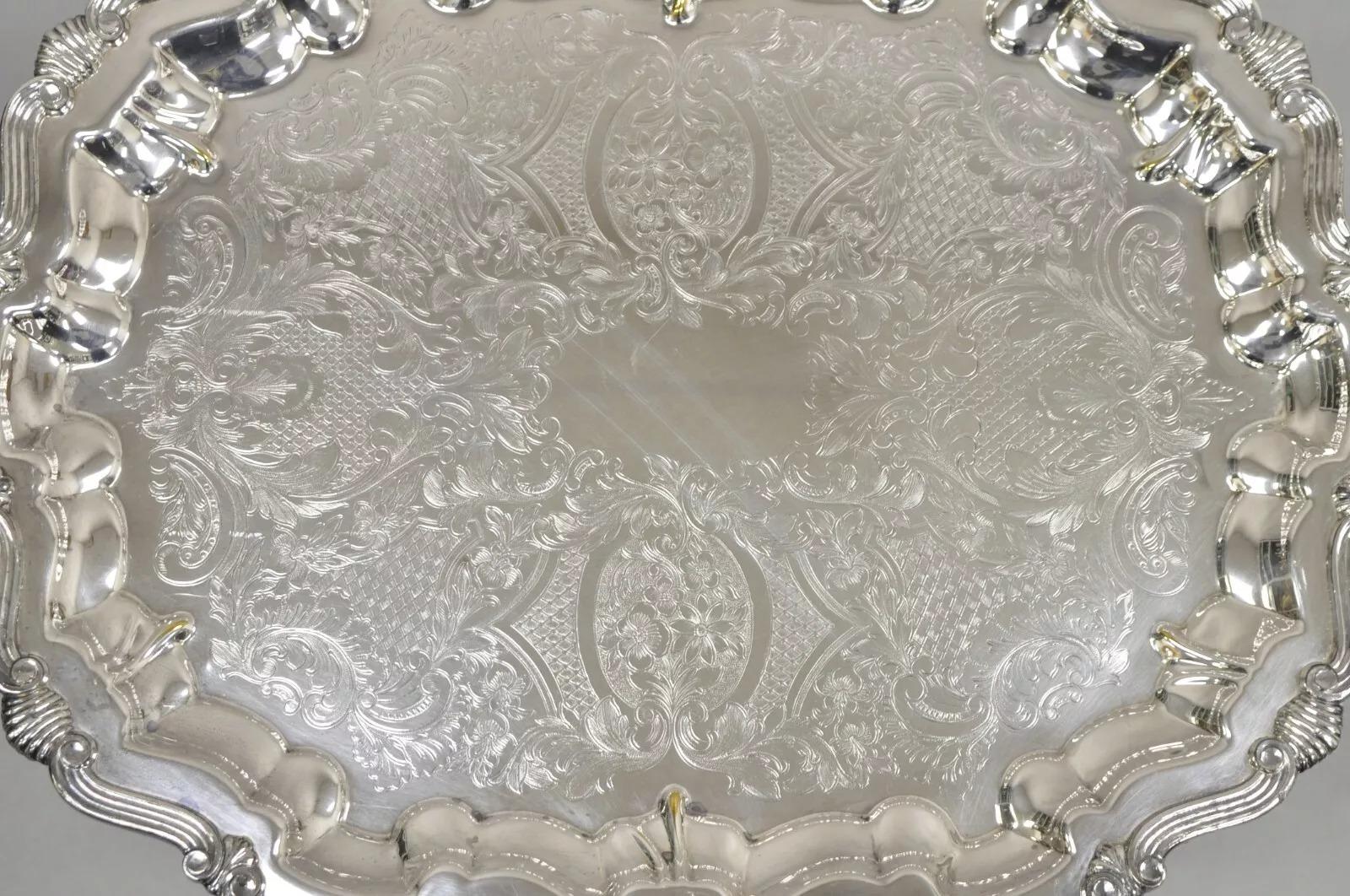 Bandeja de servir de estilo barroco vintage Lunt plateada con dos asas ornamentadas. Mediados del siglo XX. Medidas: 1,5