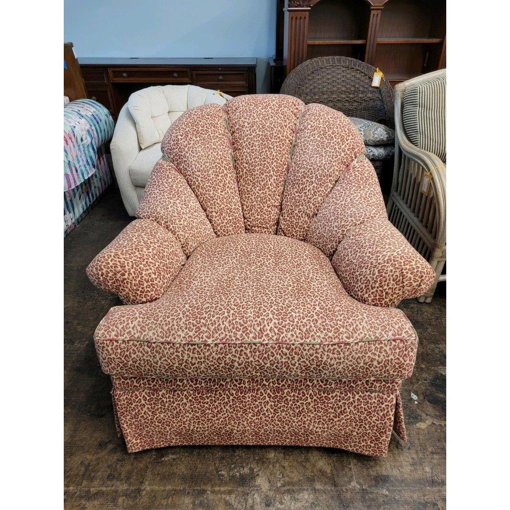 Custom made by Kravet Furniture, this swivel lounge chair with ottoman is amazingly comfortable and elegant at the same time.. The chair features English arms and an arched back with double welt cords to create a channel back design. The half-round