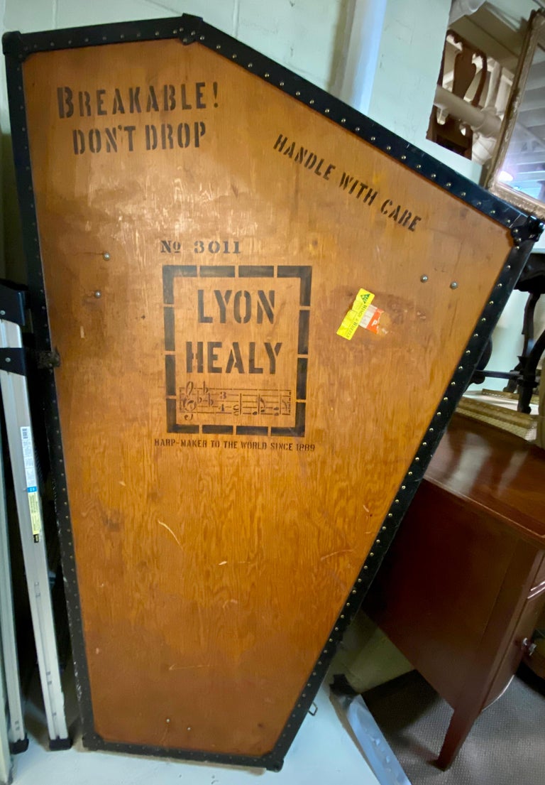 Vintage lyon and healy harp case.This beautiful antique Lyon & Healy harp case dates back to the early 1900s. The case is in very good condition with hinges, latches, and working lock without key. The dimensions are 77.5
