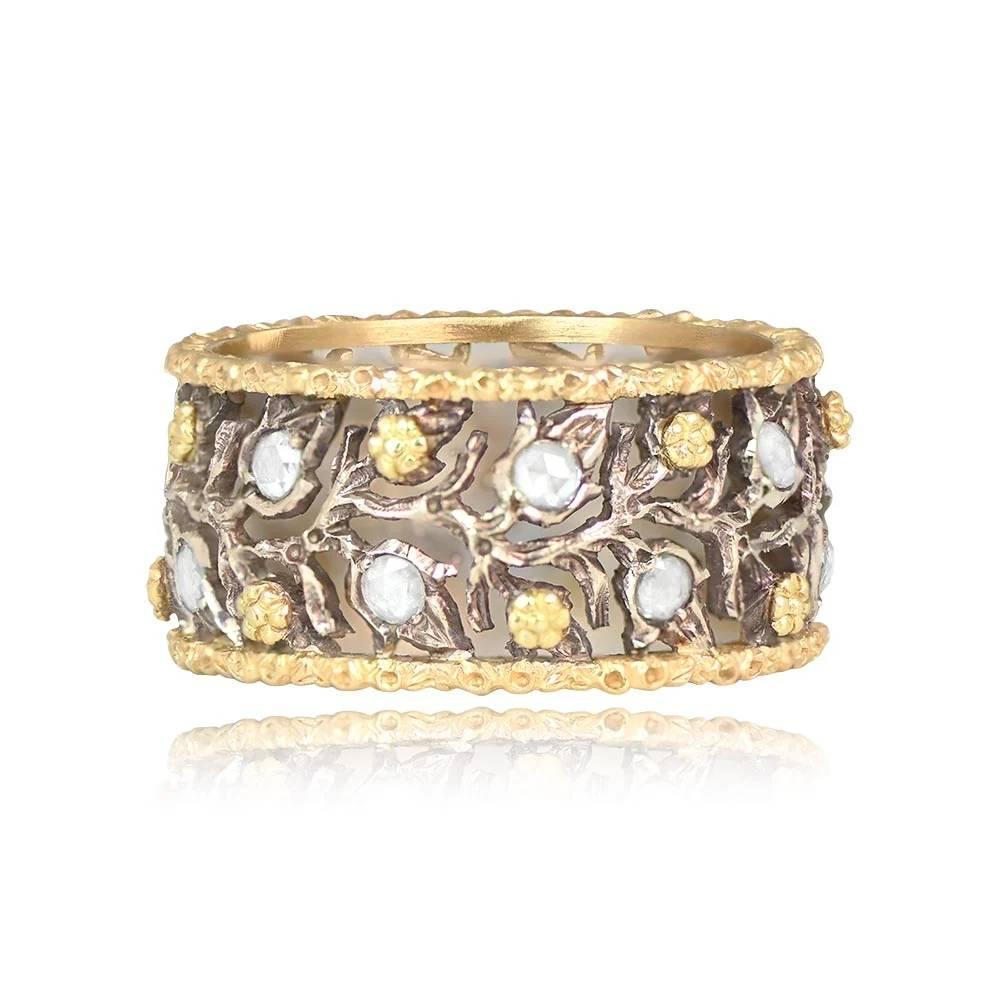 A beautiful Buccellati wedding band featuring a captivating floral and leaf motif openwork design. The leaves are adorned with round rose-cut diamonds, totaling approximately 0.35 carats. Handcrafted in silver and 18k yellow gold, signed M.