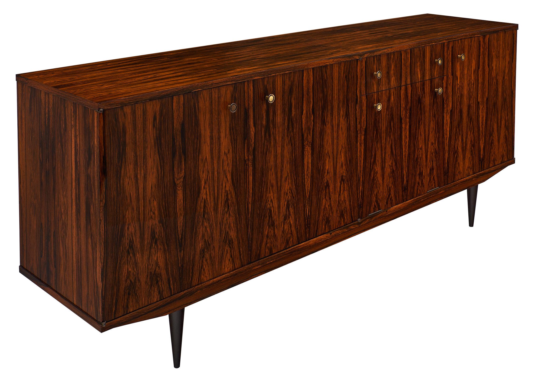 French vintage Macassar credenza with original lacquered finish, tapered legs and brass pull hardware. This stunning buffet has two door compartments that open to adjustable shelves, one unique drop-down compartment that opens to a bar area with a