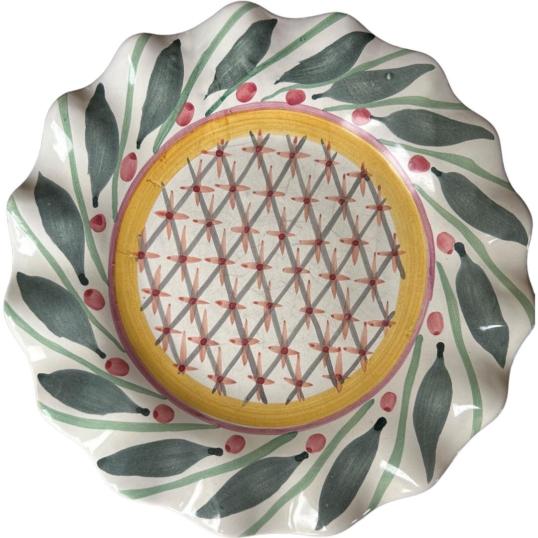 Add a touch of vintage charm to your dinner table with these beautiful MacKenzie-Childs “Brighton Pavillion” dinner plates.  The plates feature a stunning fluted rim design and are handcrafted from clay with a multicolor pattern that is sure to