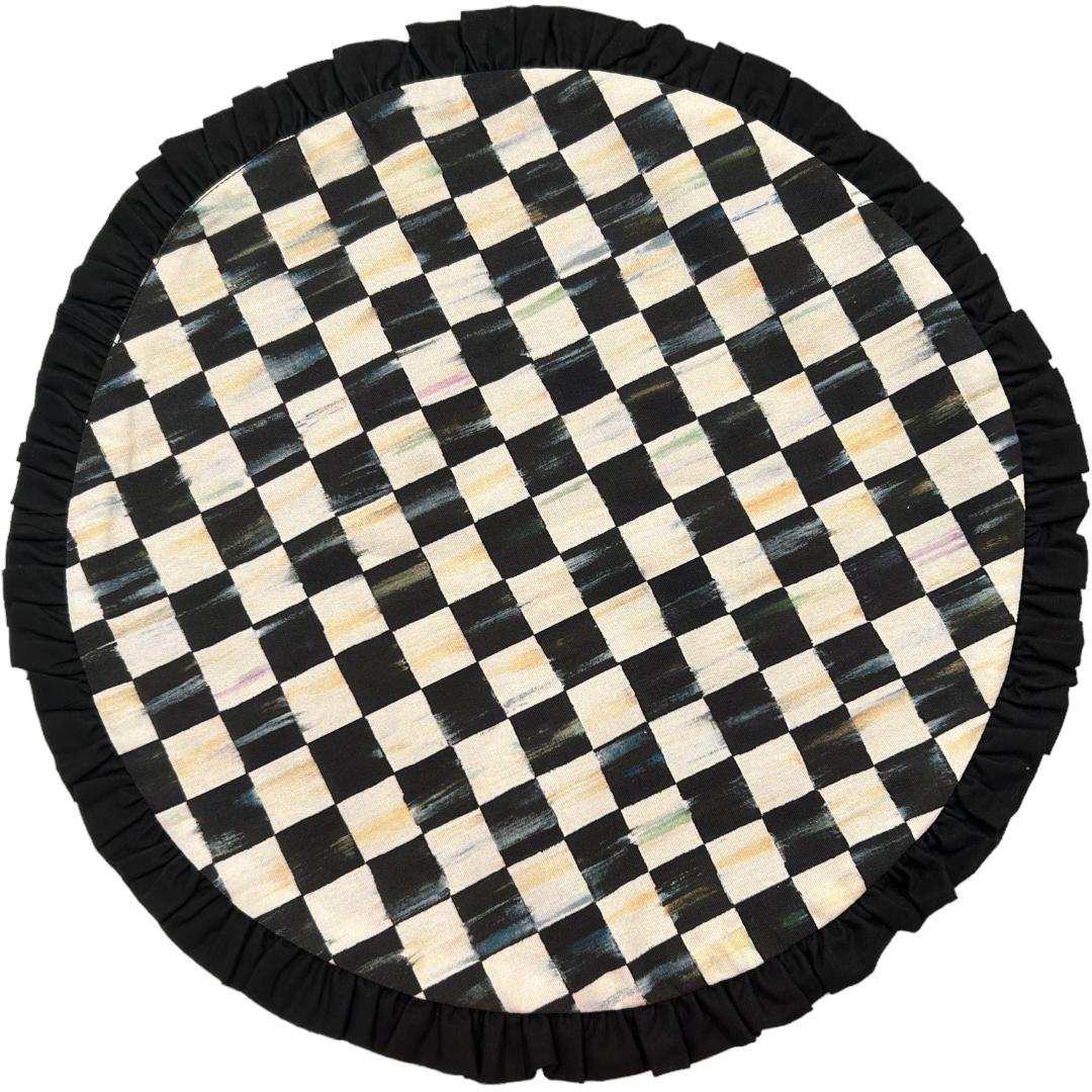 Spice up your dining experience with this beautiful set of four round placemats from MacKenzie-Childs.  The “Courtly Check” pattern adds a touch of elegance to any table setting, while the high-quality materials ensure long-lasting use.  The