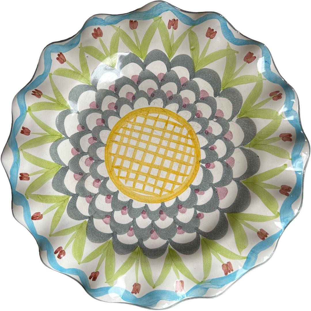 Add a touch of vintage charm to your dining table with this set of two round dinner plates from MacKenzie Childs.  The plates feature a beautiful “King Ferry” pattern with a glossy finish and are made of high-quality clay.  These handmade plates are