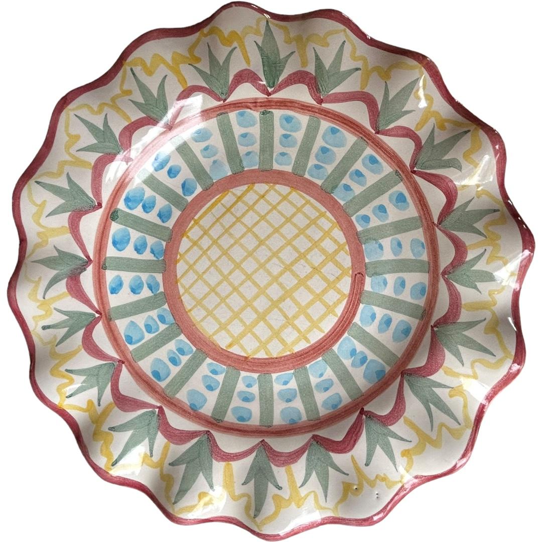 Add a touch of vintage charm to your dining table with these MacKenzie Childs “Madison” decorative fluted rim dinner plates.  The round plates feature a beautiful multicolor pattern made of clay and paint. Perfect for all occasions, these dinner