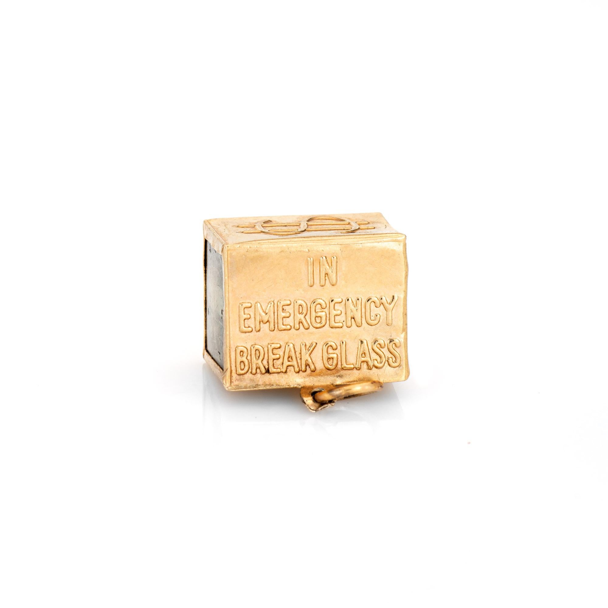 Fun vintage 'Mad Money' charm crafted in 14k yellow gold (circa 1940s to 1950s).  

The four sided charm features a dollar bill folded and placed in the center of the charm, with 