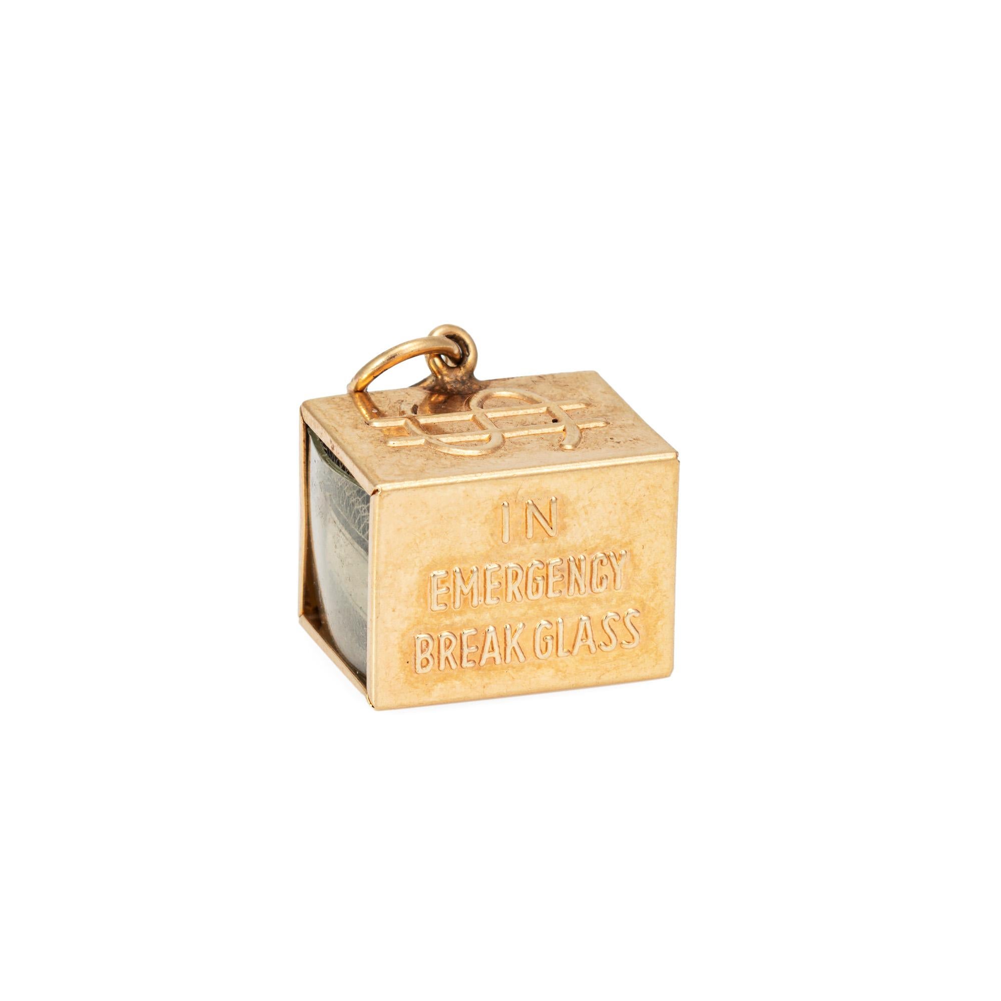 Fun vintage 'Mad Money' charm crafted in 14k yellow gold (circa 1940s to 1950s).  

The four sided charm features a dollar bill folded and placed in the center of the charm, with 