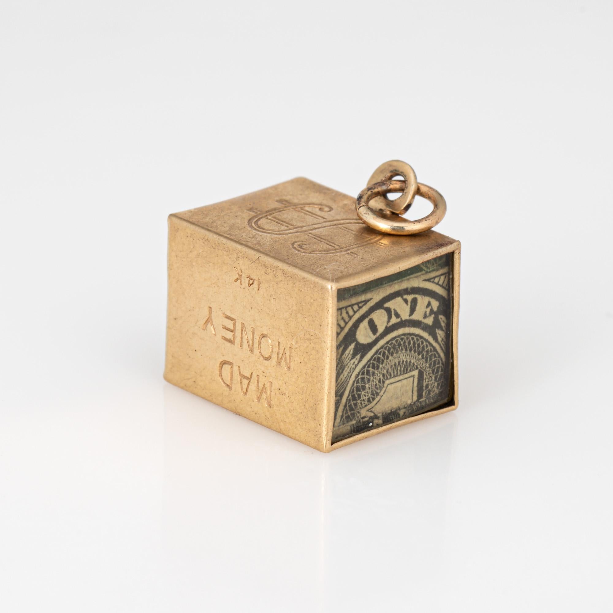 Fun vintage 'Mad Money' charm crafted in 14k yellow gold.  

The four sided charm features a dollar bill folded and placed in the center of the charm, with 
