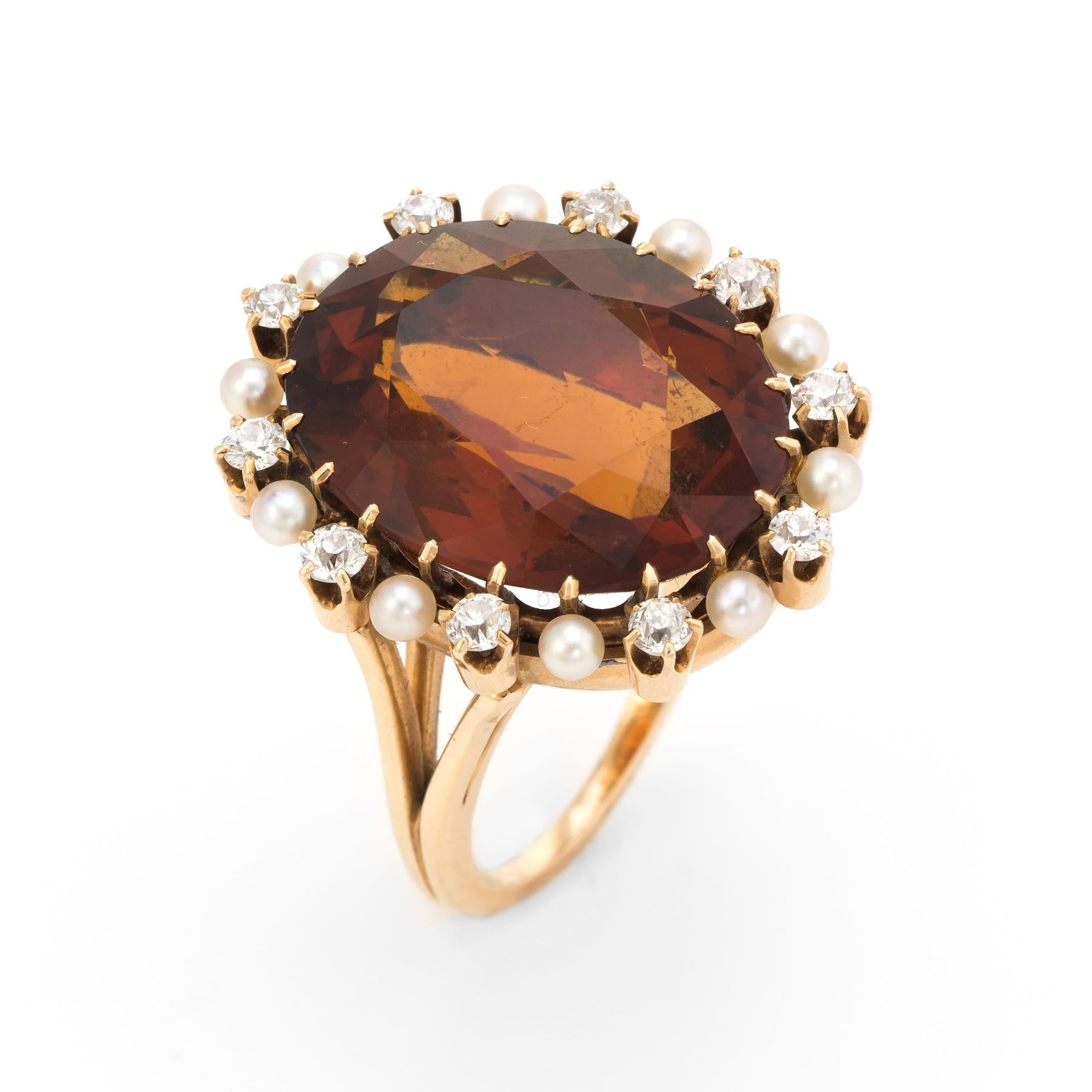 Finely detailed vintage large oval cocktail ring (circa 1940s to 1950s), crafted in 14 karat yellow gold. 

Centrally mounted faceted oval madeira citrine measures 20mm x 16mm (estimated at 20 carats), accented with 10 approx. 0.04 carat old mine