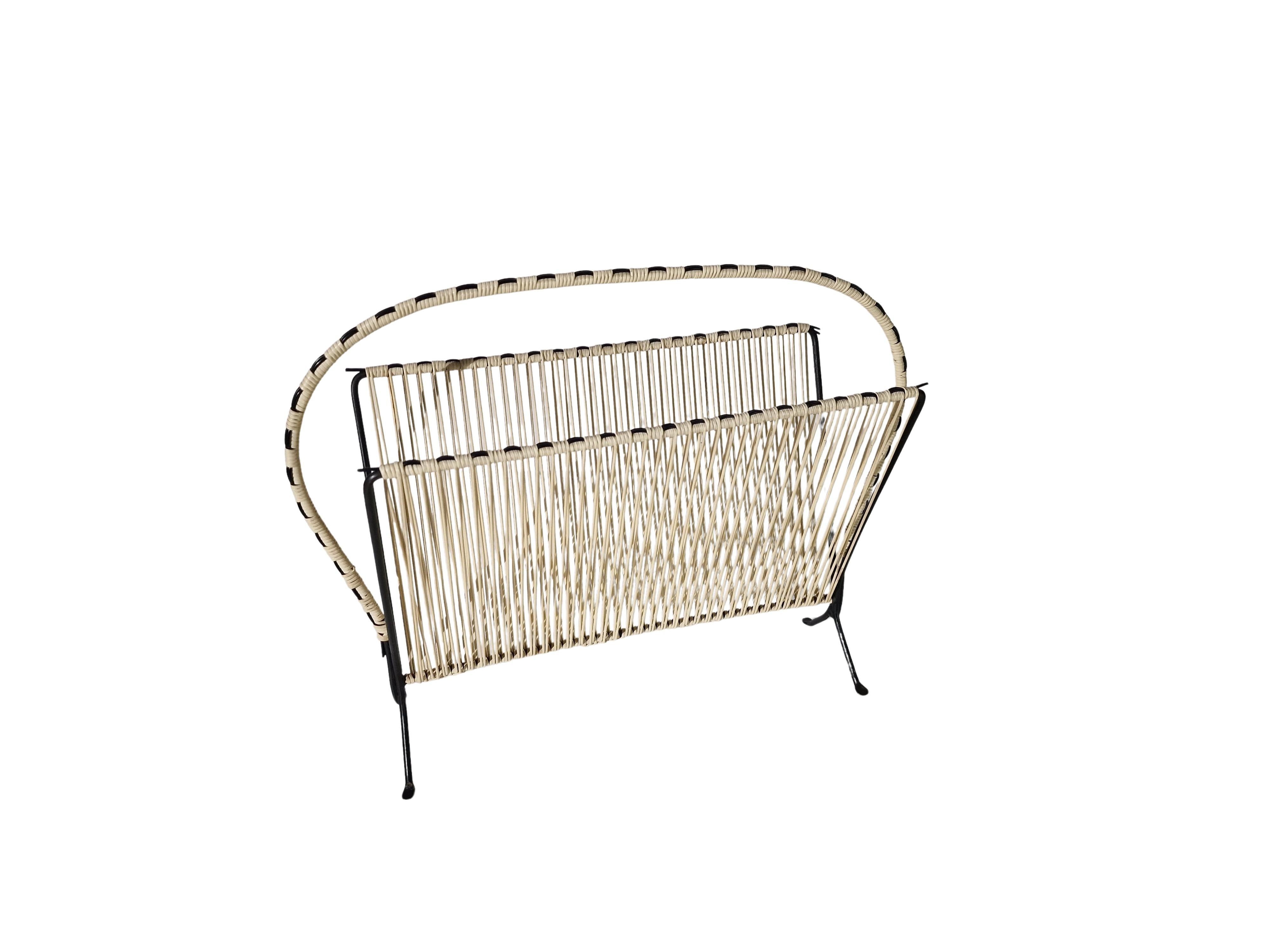 Vintage magazine holder newspaper rack, string Design, 1950s, Italy
This newspaper holder is a particularly beautiful example of Italian design from the 1950s. 

The color scheme is black and white. The newspaper holder is made of black metal and