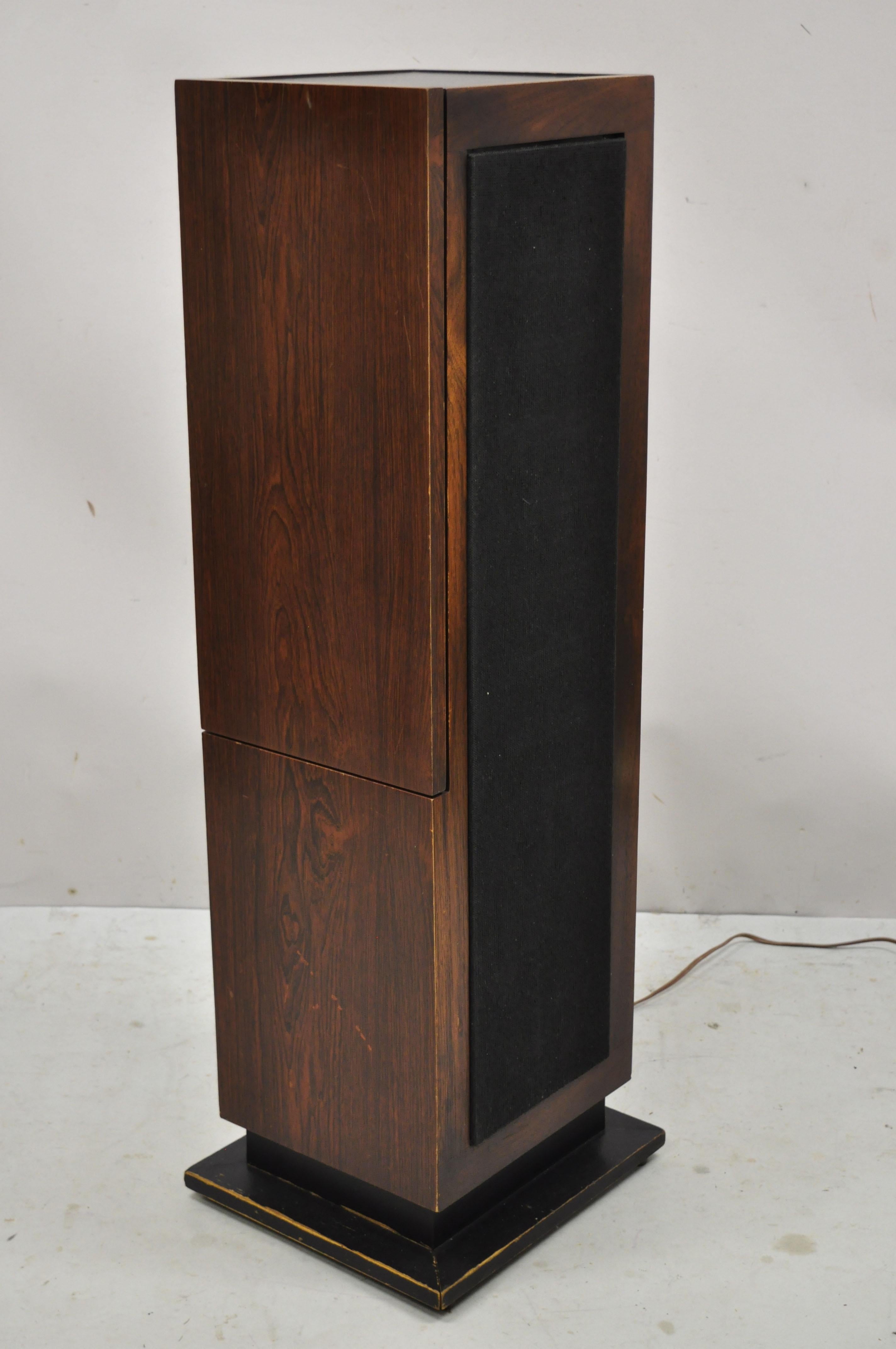 Vintage Magnavox Mid-Century Modern tower column pedestal rodeo stereo 8 track console. Item features working AM/FM radio, side speakers, slate pedestal top, 8 track player (not working), original label, very nice vintage item. Circa 1970s.