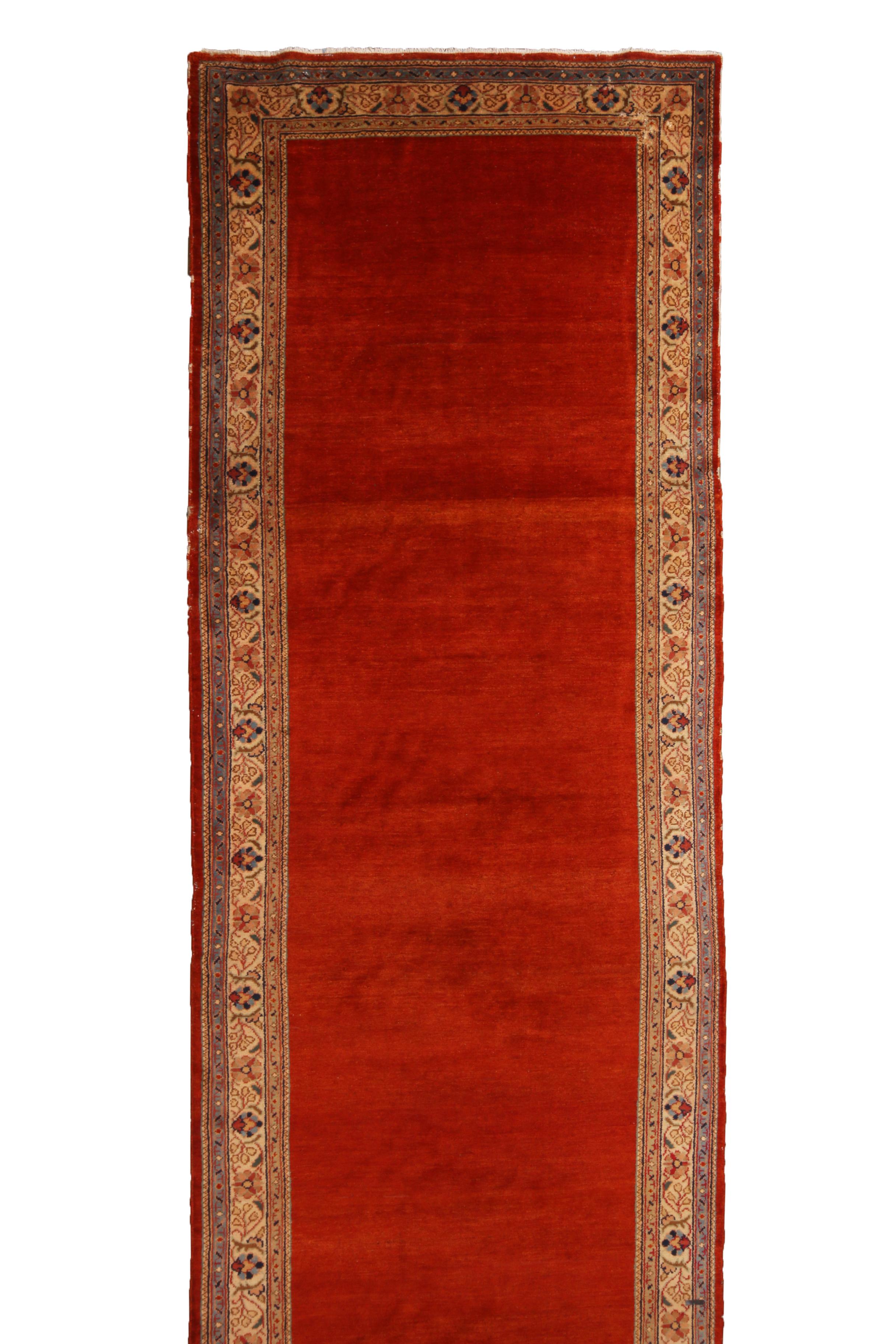 Originating from Persia in 1940, this vintage Mahal Persian Runner hosts an uncommon open field design from a distinguished family of Persian weavers. Hand knotted in high quality Mahal wool (known for being more finely woven than most Persian