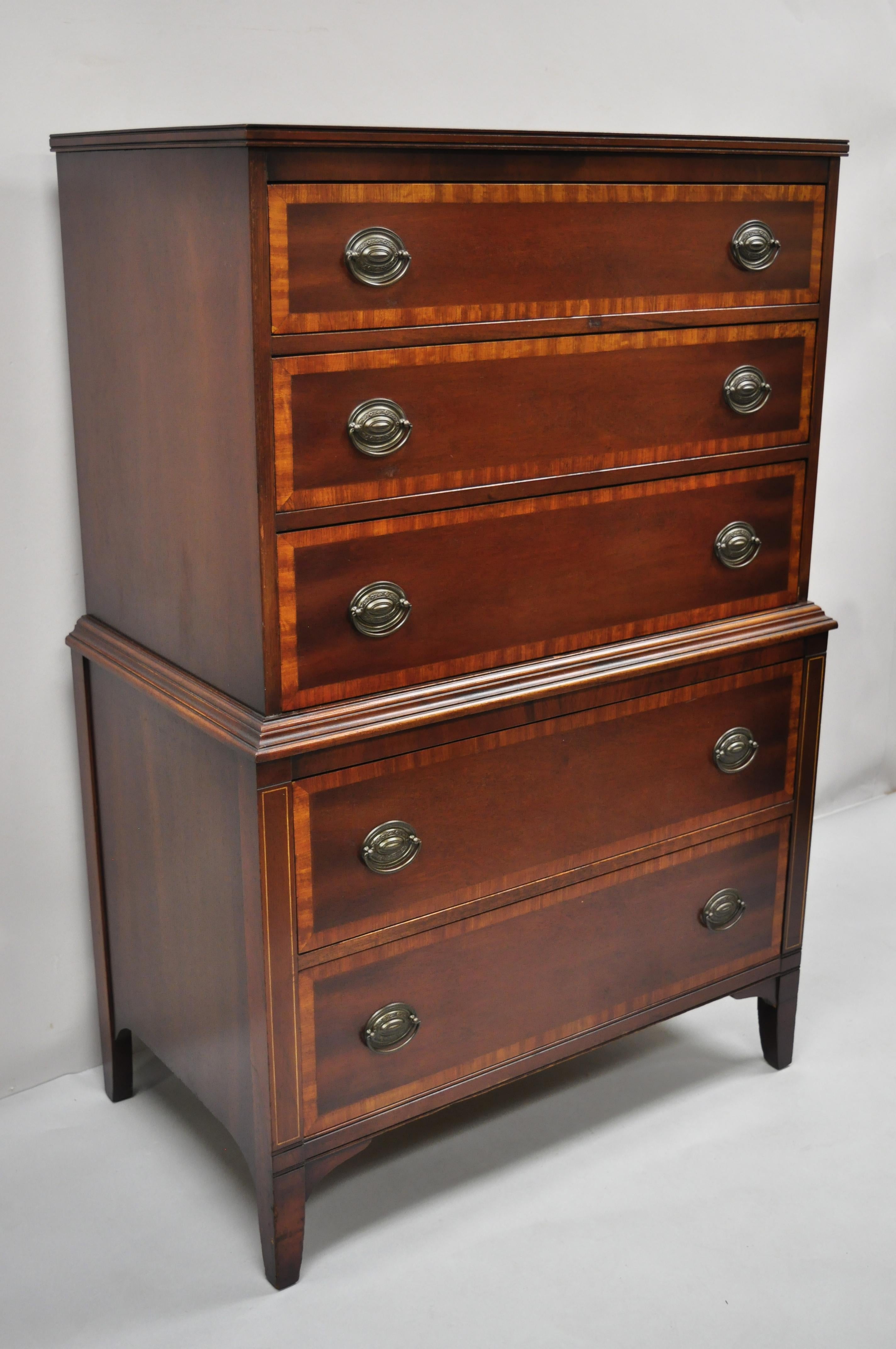 Vintage mahogany 5 drawer banded inlay tall chest dresser highboy by Stiehl. Item features banded inlay drawer fronts, beautiful wood grain, original label, 5 dovetailed drawers, tapered legs, solid brass hardware, quality American craftsmanship.