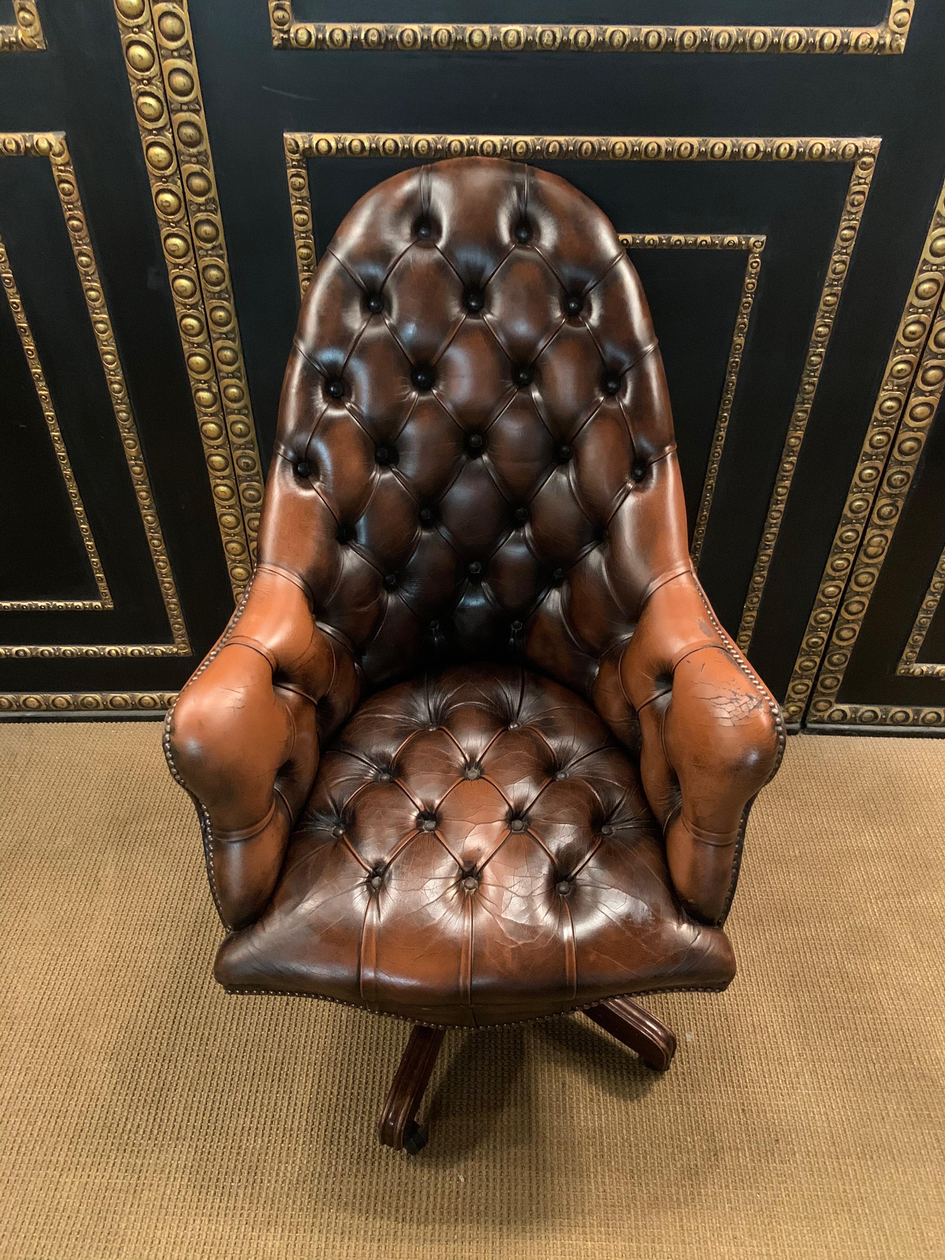 We are delighted to offer this lovely original vintage hand dyed Mahogany brown leather Chesterfield tufted directors chair A very good looking well made and comfortable directors chair. Its Chesterfield buttoned both back and base, the seat