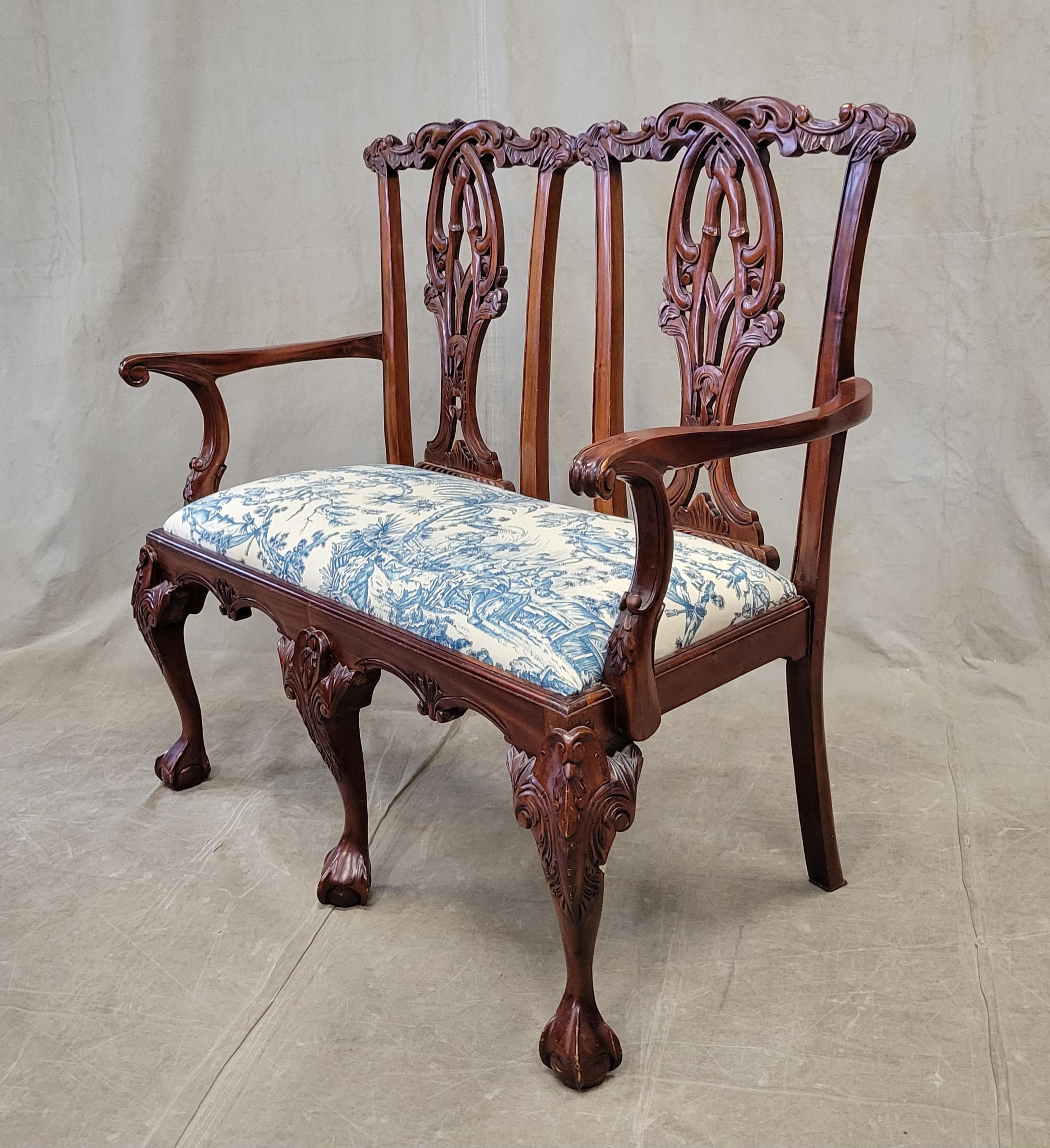 A charming vintage mahogany Chippendale style two-seat bench newly upholstered with Schumacher 