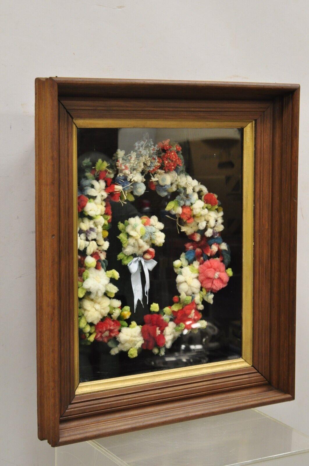 Vintage mahogany deep shadow box frame felt cotton mourning wreath wall art. Item features a nice deep frame, cotton felt handmade wreath, solid wood frame, beautiful wood grain, very nice antique item. Circa 1900. Measurements: 27.5