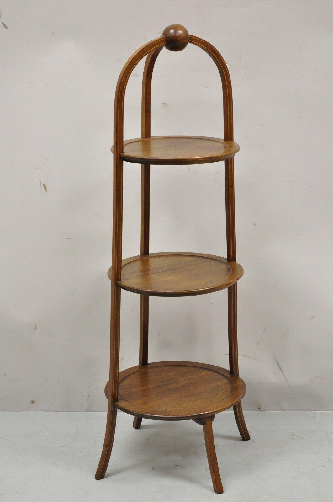 Vintage Mahogany Edwardian Style 3 Tier Muffin Stand with Pencil Inlay. Item features satinwood pencil inlay, 3 tiers, beautiful wood grain, shapely saber legs, quality American craftsmanship, great style and form. Circa early to Mid 20th Century.