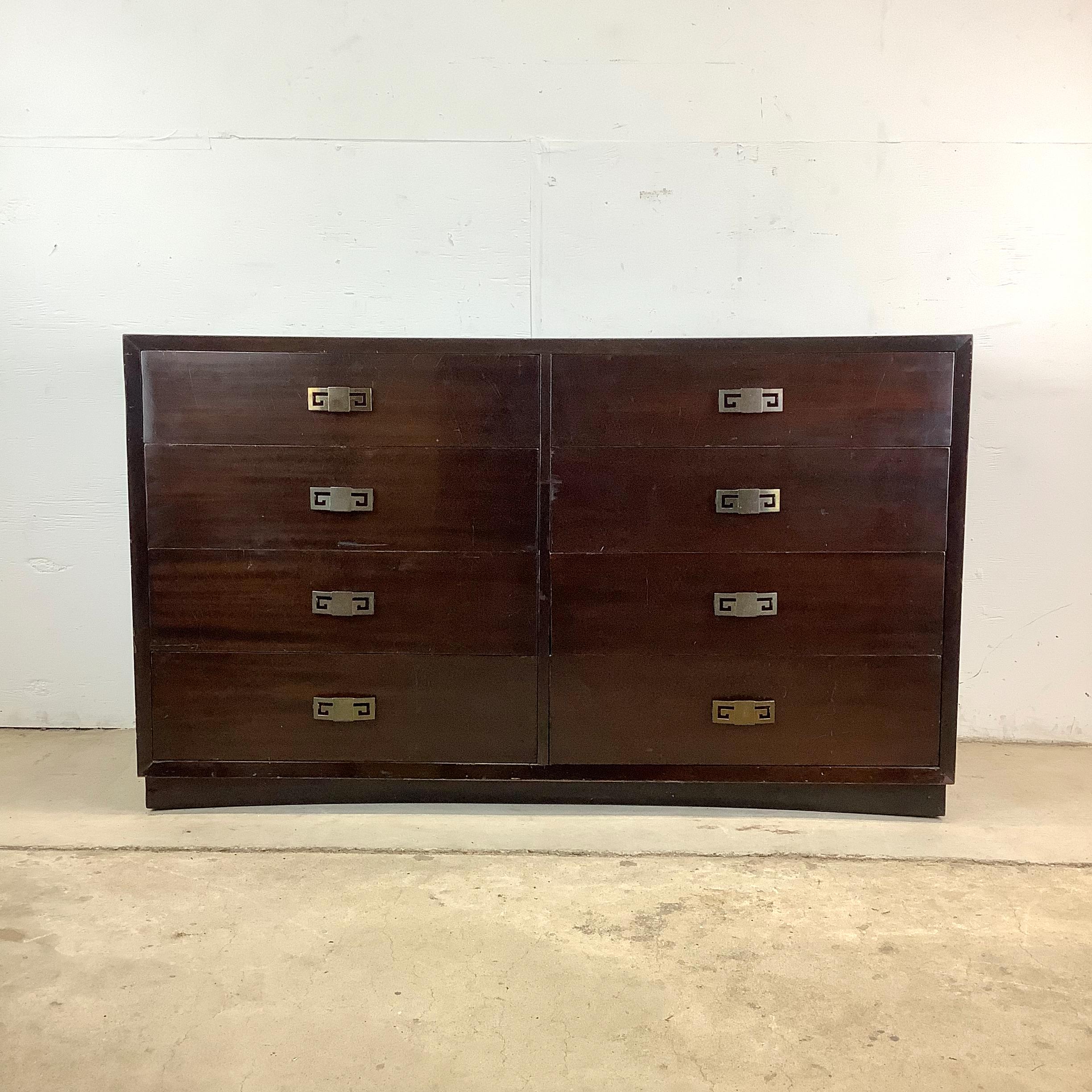 This vintage mahogany dresser is more than just a practical storage piece—it’s a work of decorative art. With eight roomy drawers, elegant metal pulls, and a streamlined mid-century structure, it strikes a sophisticated balance between utility and