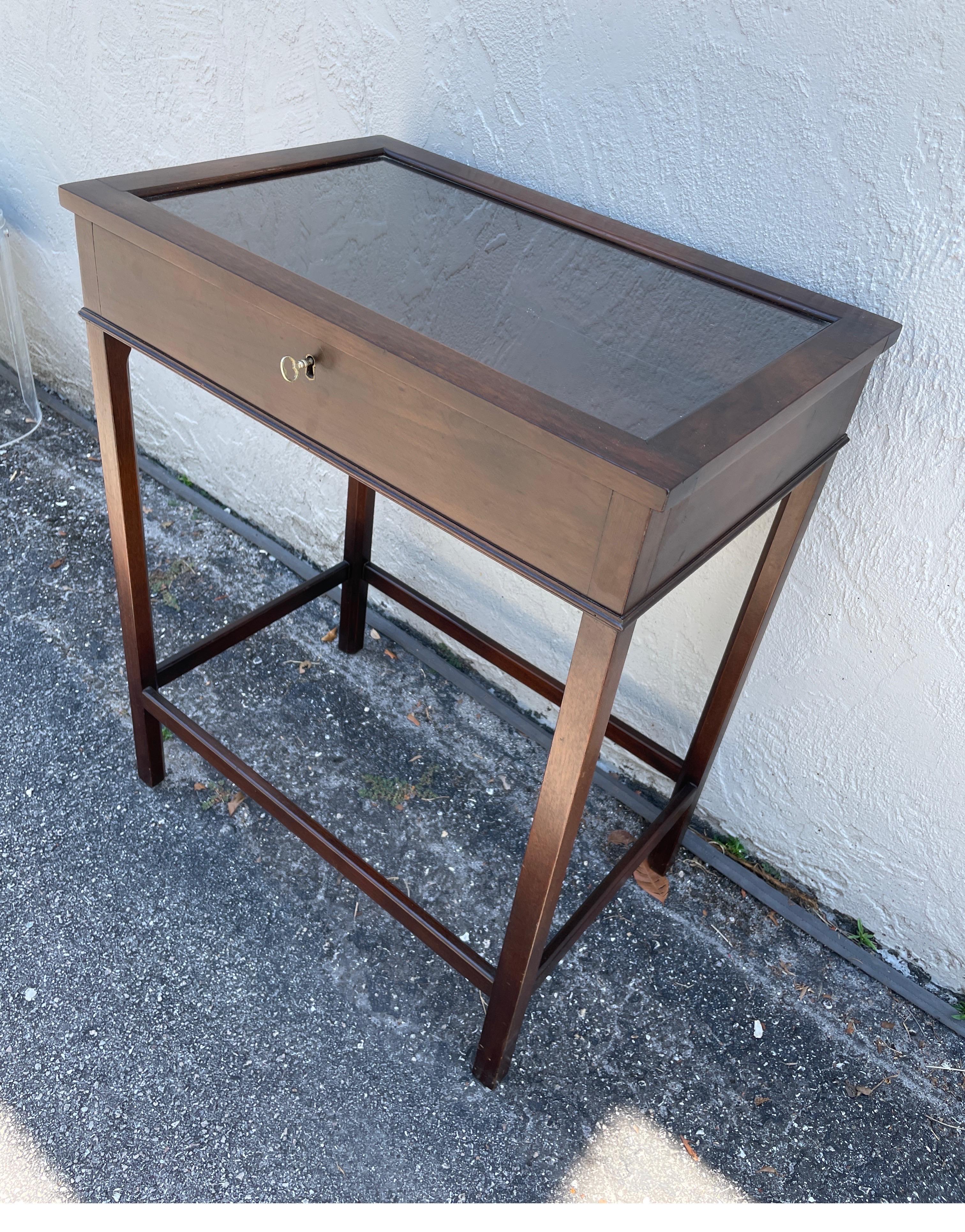 Vintage classical style display table with locking top.