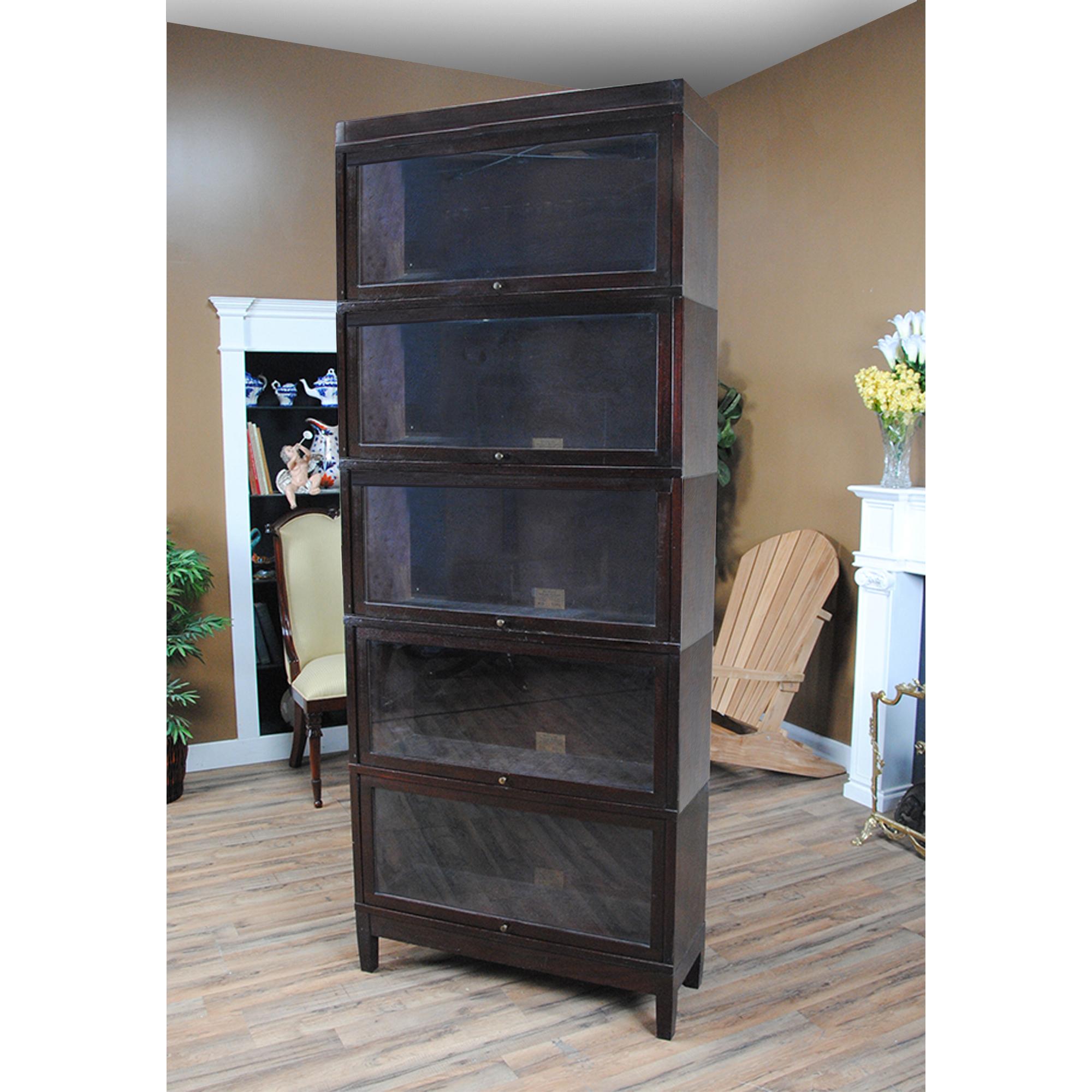 A Vintage mahogany globe Wernicke bookcase – the perfect addition to any home or office space! Crafted from high-quality mahogany wood, this bookcase is about 100 years old but still exudes the same elegance and sophistication as when it was first