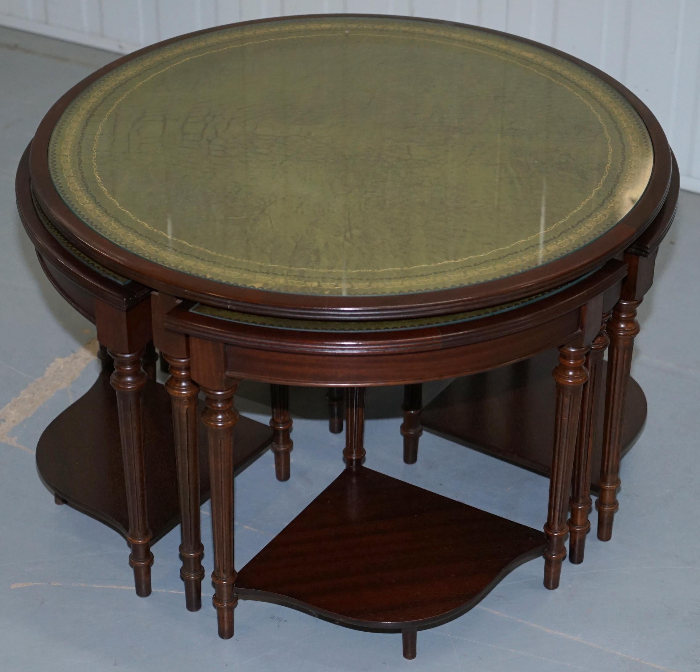 We are delighted to offer for sale this very nicely made Mahogany round table with green leather top which recess four triangle nesting tables

This is a very functional and decorative piece of furniture, each table has a fully aniline 100% cattle
