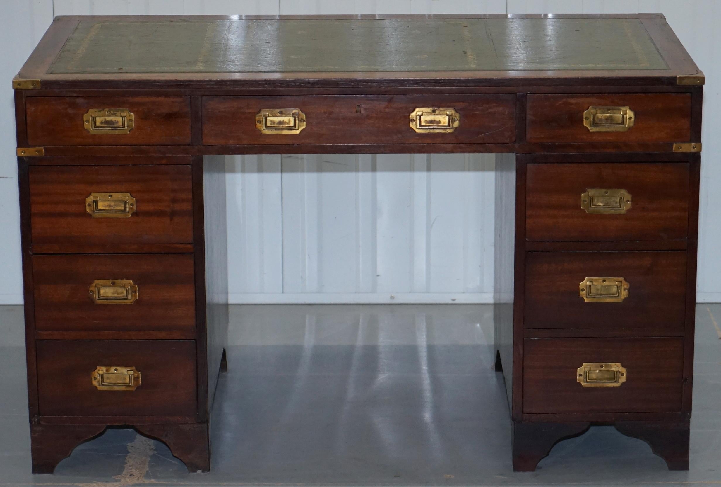 We are delighted to offer for sale this lovely vintage mahogany with green leather top Military Campaign style twin pedestal partner desk

The desk is in a very popular highly collected style, military campaign style furniture is absolutely