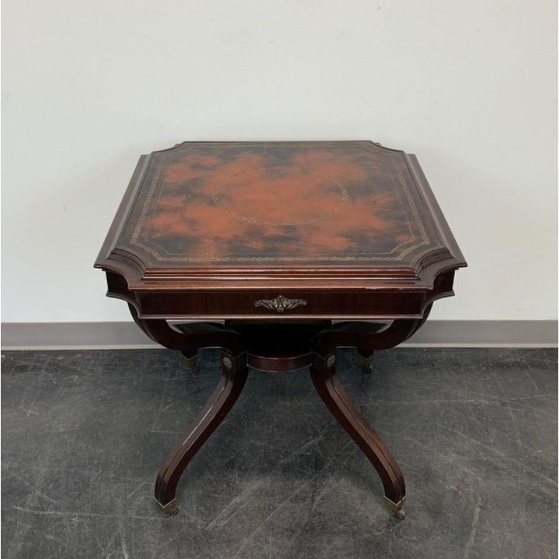 A vintage high quality Federal style lamp table, unbranded. Mahogany with tooled leather top, brass accents, round undertier, curved legs and brass casters. Likely originated in the USA, circa 1940s.

Measures: 28.5w 28.5d 29h

Exceptionally good