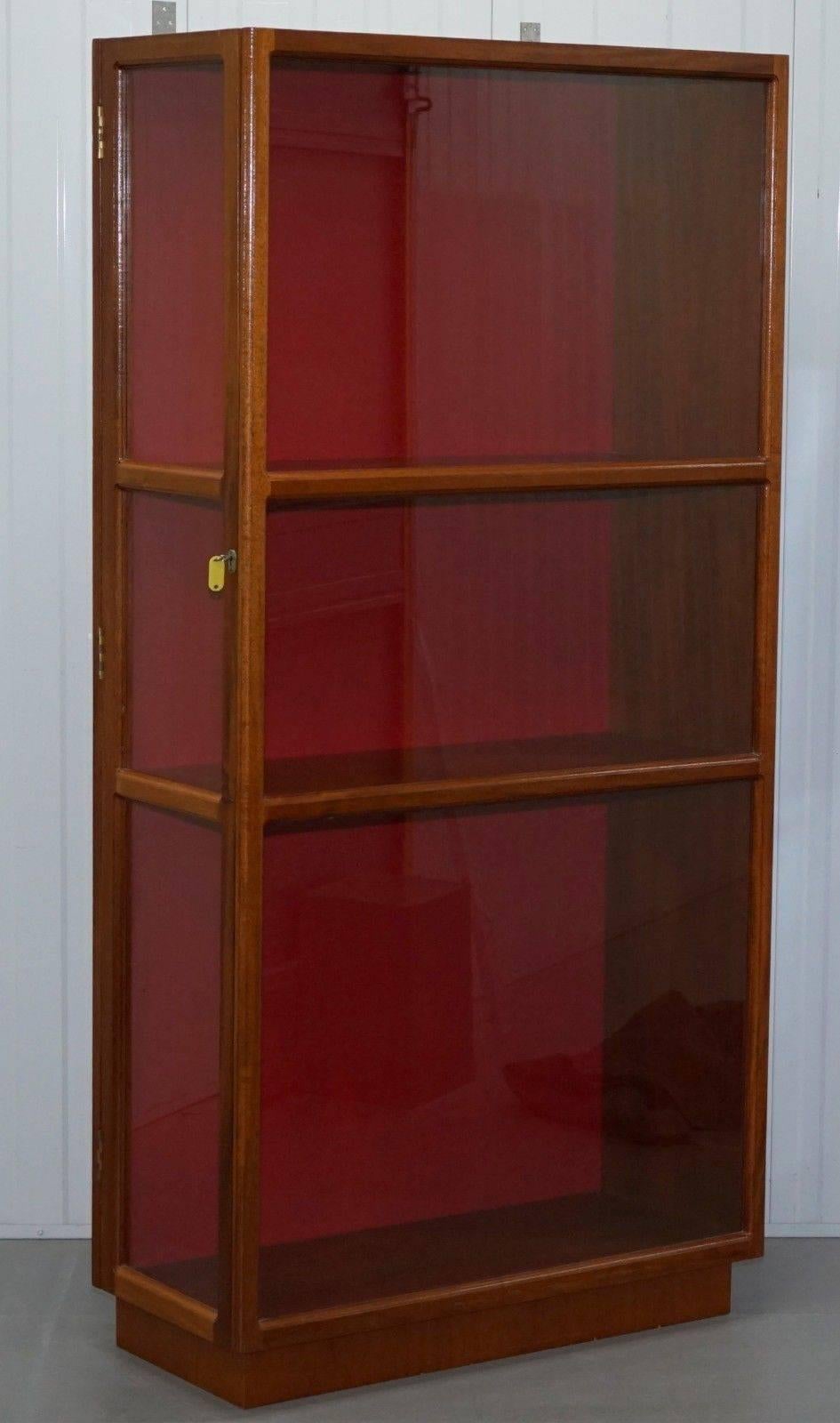 We are delighted to offer for sale this lovely mid-century light mahogany glazed display cabinet with side locking door

A very good looking well-made piece in lightly restored condition, we have deep cleaned hand condition waxed and hand polished