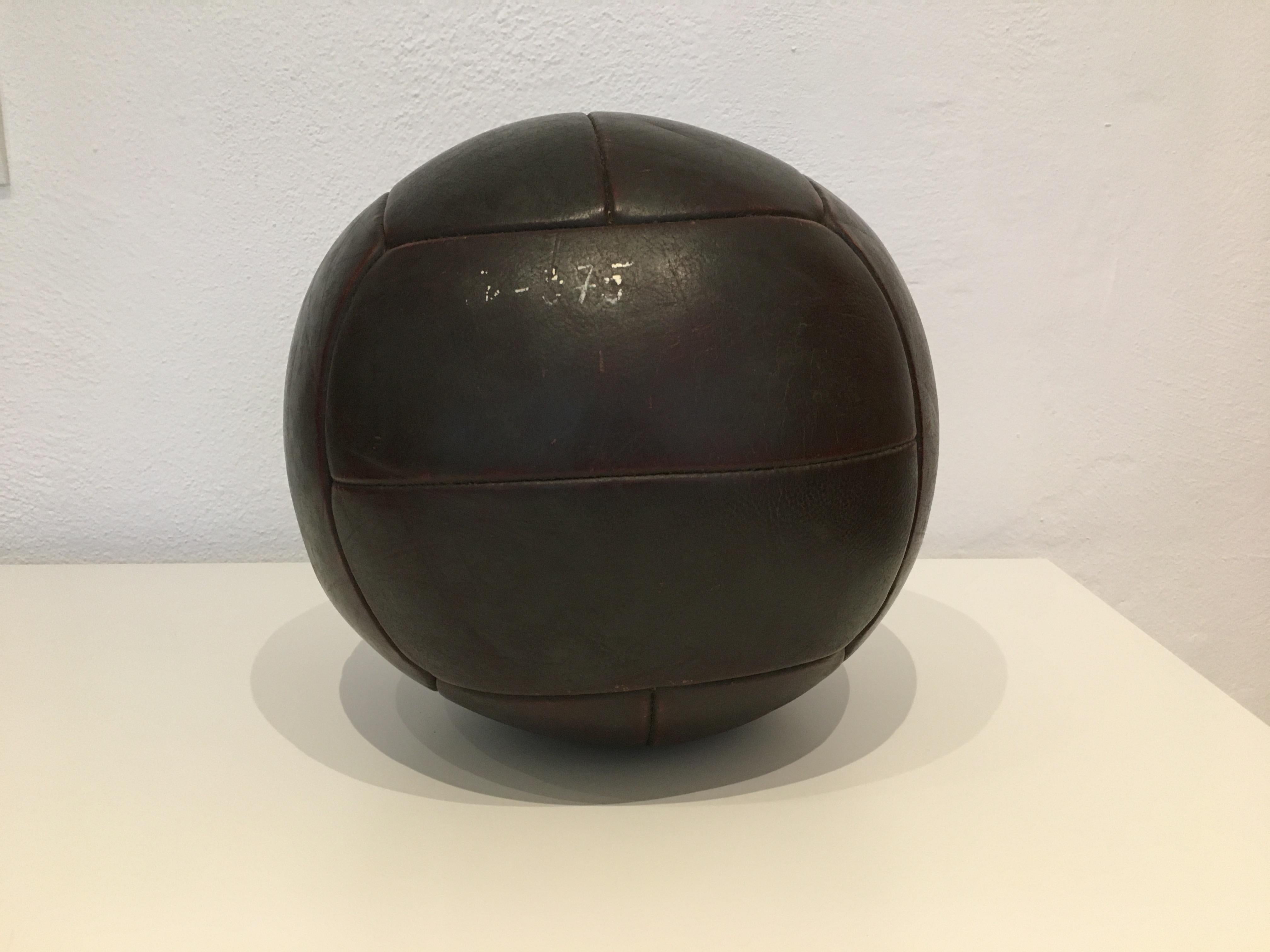 This medicine ball comes from the stock of an old Czech gymnasium. Made in the 1930s. Patina consistent with age and use. Cleaned and treated with a special leather care. Weight: 3kg. Measures: Diameter 10.2 inch.