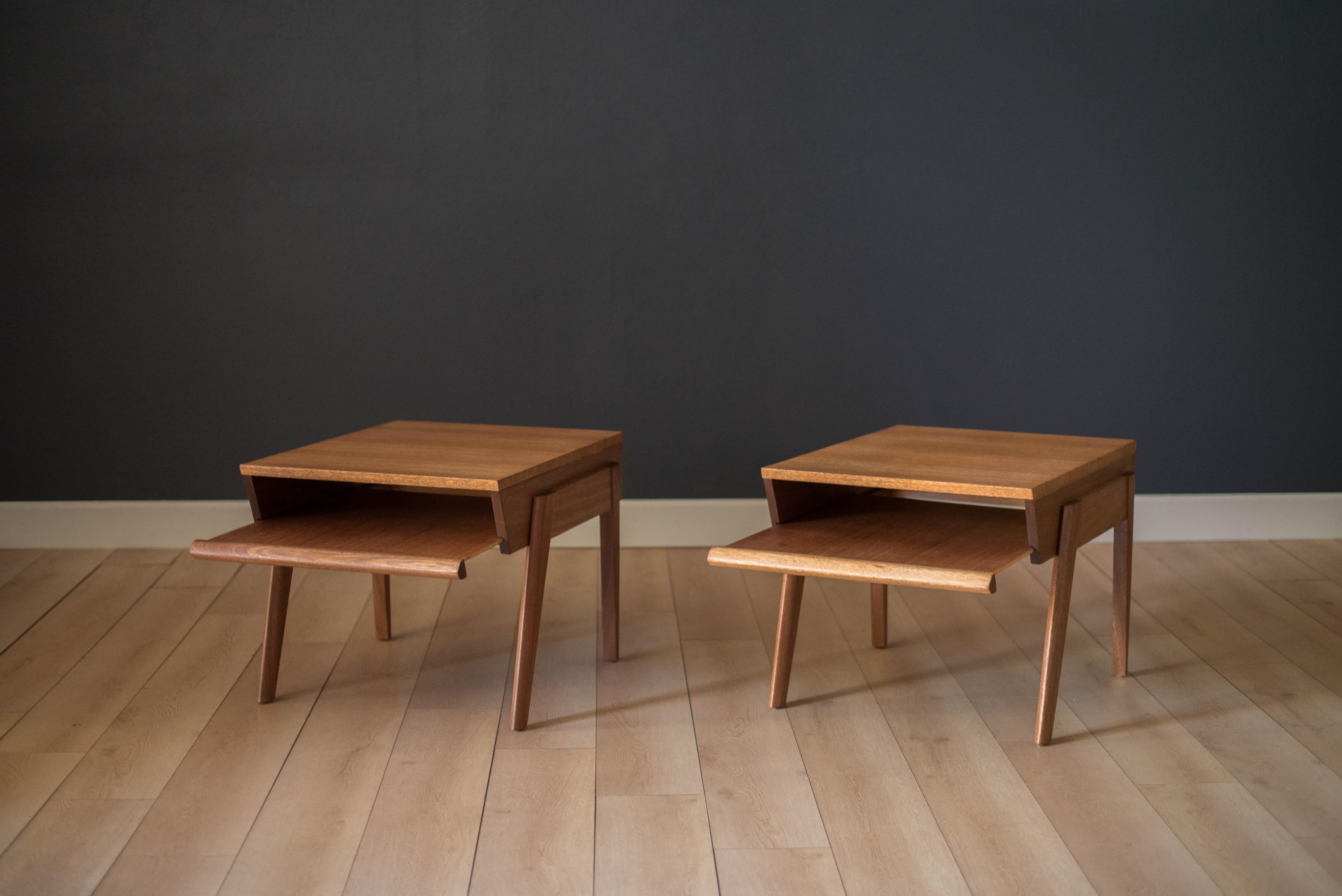 Midcentury End Tables by John Keal for Brown Saltman, California. This pair is made of mahogany and features a unique sliding open tray drawer. Price is for the pair.