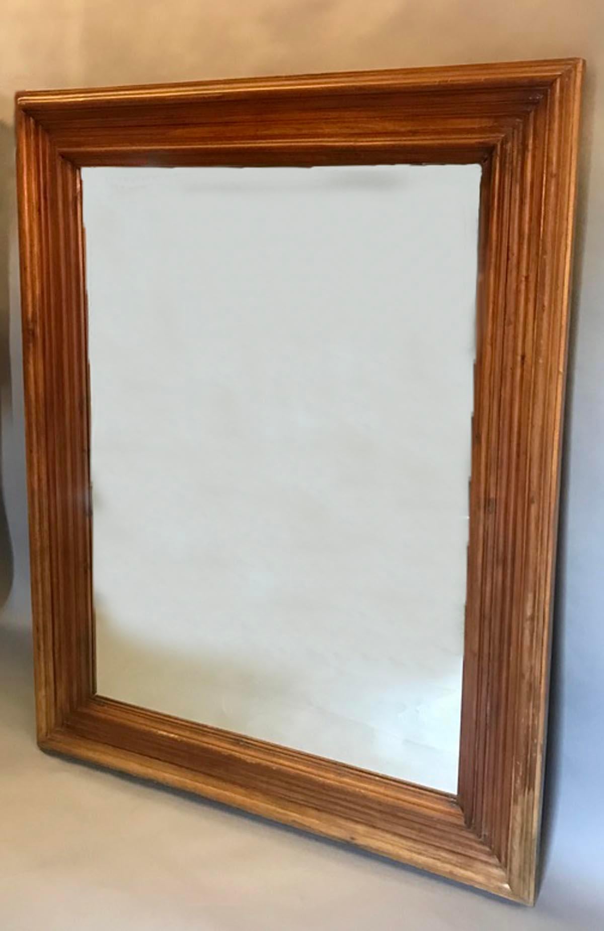 Vintage mahogany wood mirror frame with glass. In good condition. Some scratches and loss of finish and small separation in corners, but overall pretty good and sturdy to hang! Frame width is six inches
Warm honey mahogany color.