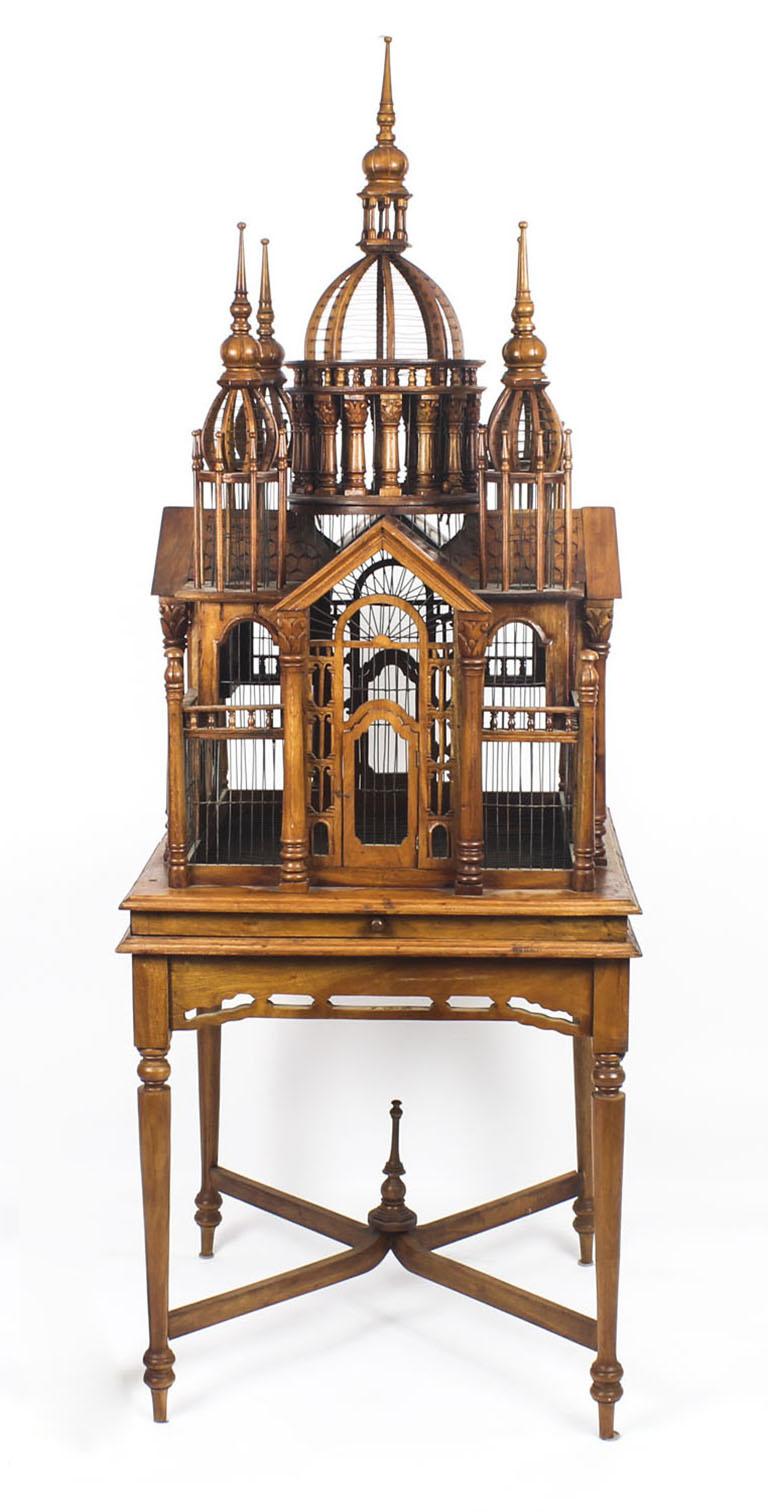 A magnificent and highly decorative vintage mahogany birdcage based on a design after the Sacre Coeur church in Montmatre, Paris, dating from the second half of the 20th century.

Featuring a central dome with four arches and carved architectural