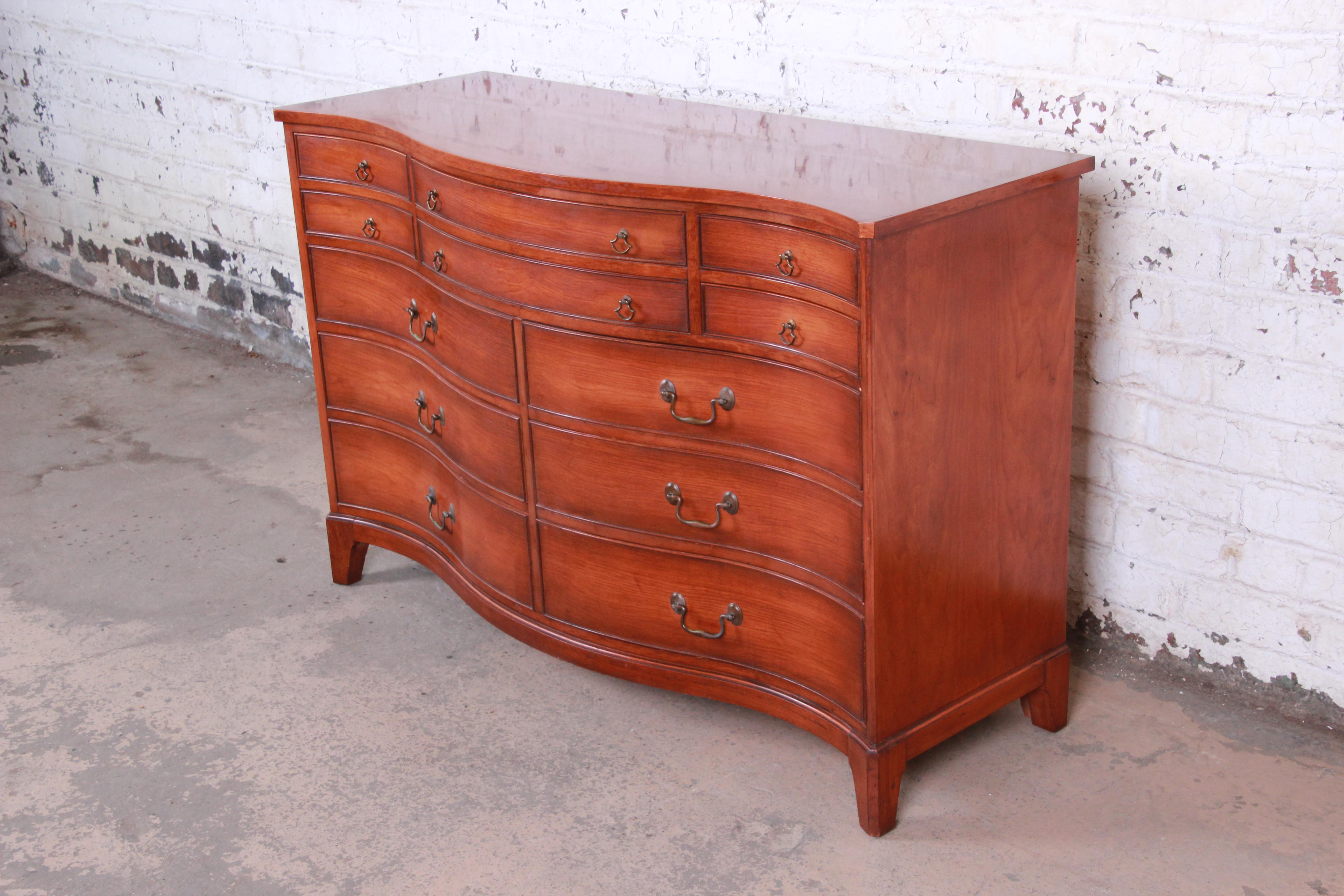 A beautiful mahogany bow front serpentine 10-drawer dresser or sideboard

Made by Morganton Furniture

USA, circa 1950s

Mahogany and brass hardware

Measures: 56.13