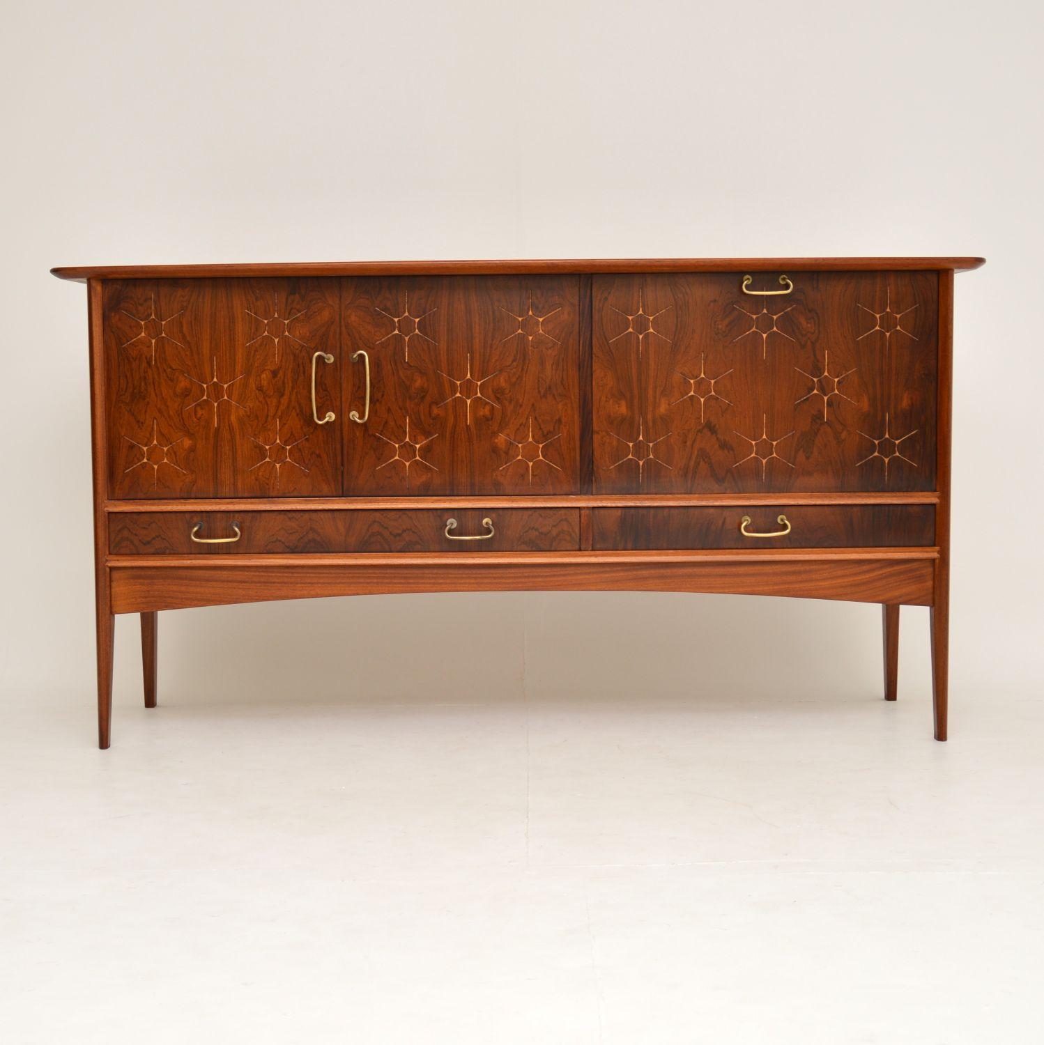 A beautiful and iconic design, this is the starburst sideboard, designed by Peter Hayward for Vanson. It dates from the 1950s-1960s, and has been fully stripped and re-polished to perfection; you’re unlikely to find one on better condition than