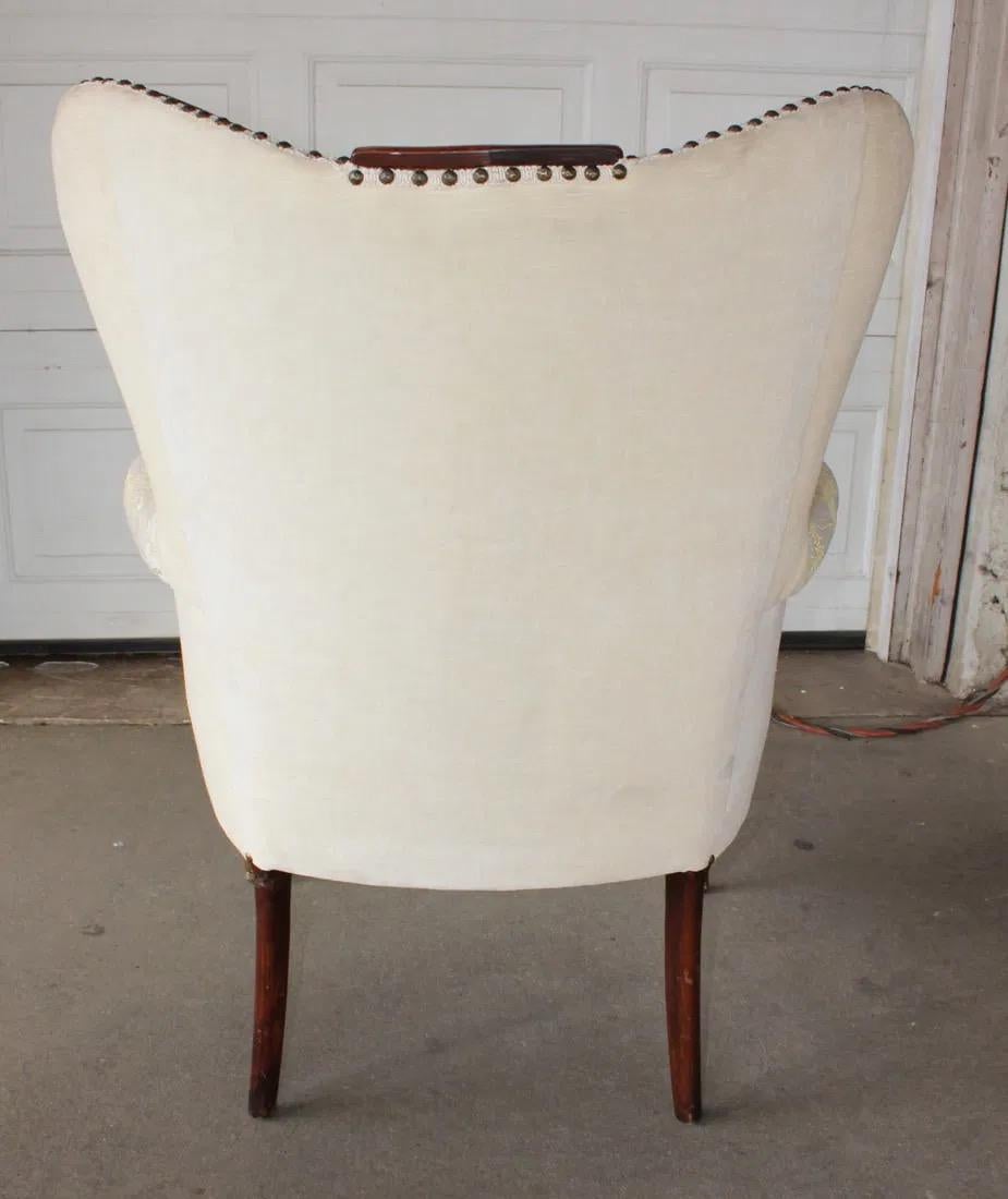 20th Century Vintage Mahogany Wingback Chair With Carved Detailing For Sale