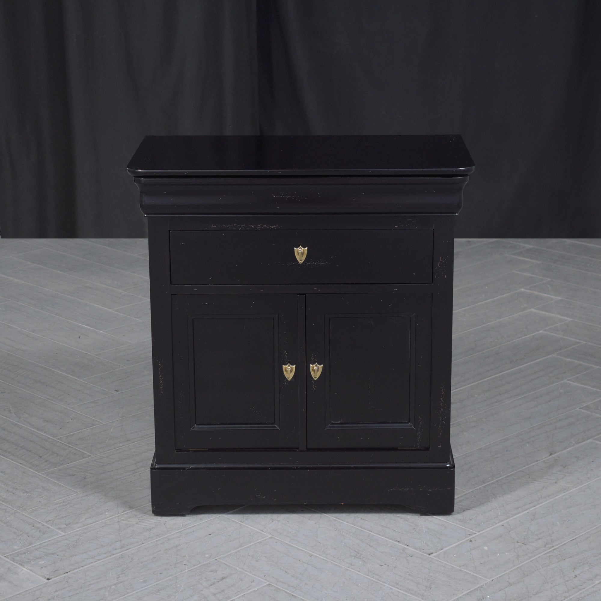 Elevate your bedroom with our vintage bedside table, a piece that exemplifies handcrafted elegance. Made from premium mahogany wood, our skilled in-house team of professional craftsmen has expertly restored this nightstand to its original glory. The