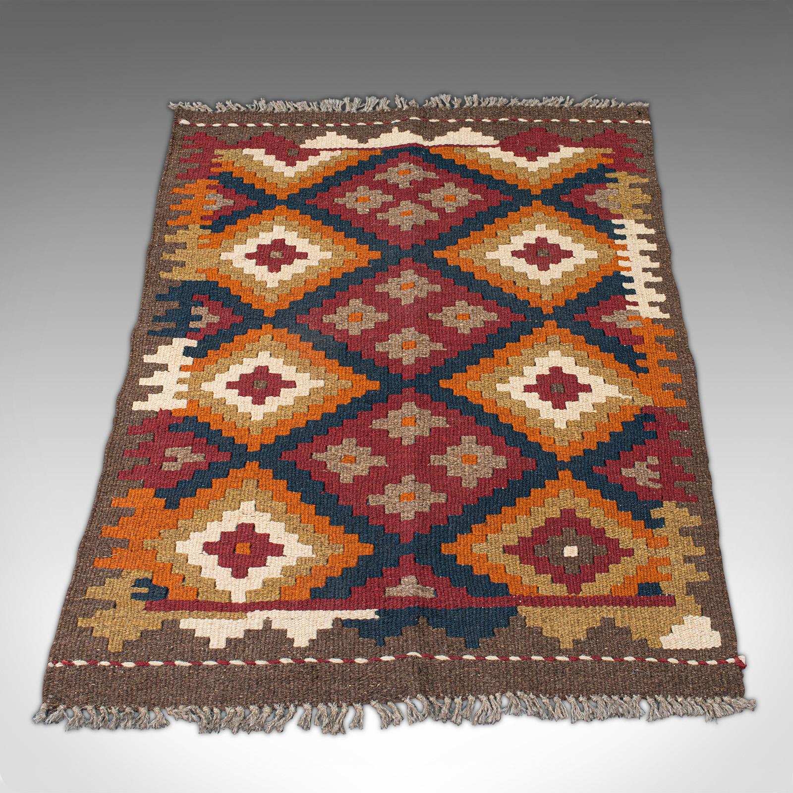 This is a small vintage Maimana Kilim rug. A Caucasian, woven decorative carpet or mat, dating to the late 20th century.

Delightfully sized for a prayer mat or doorway at 63.5cm (25'') x 92cm (36.25'')
Artisan hand-crafted using traditional