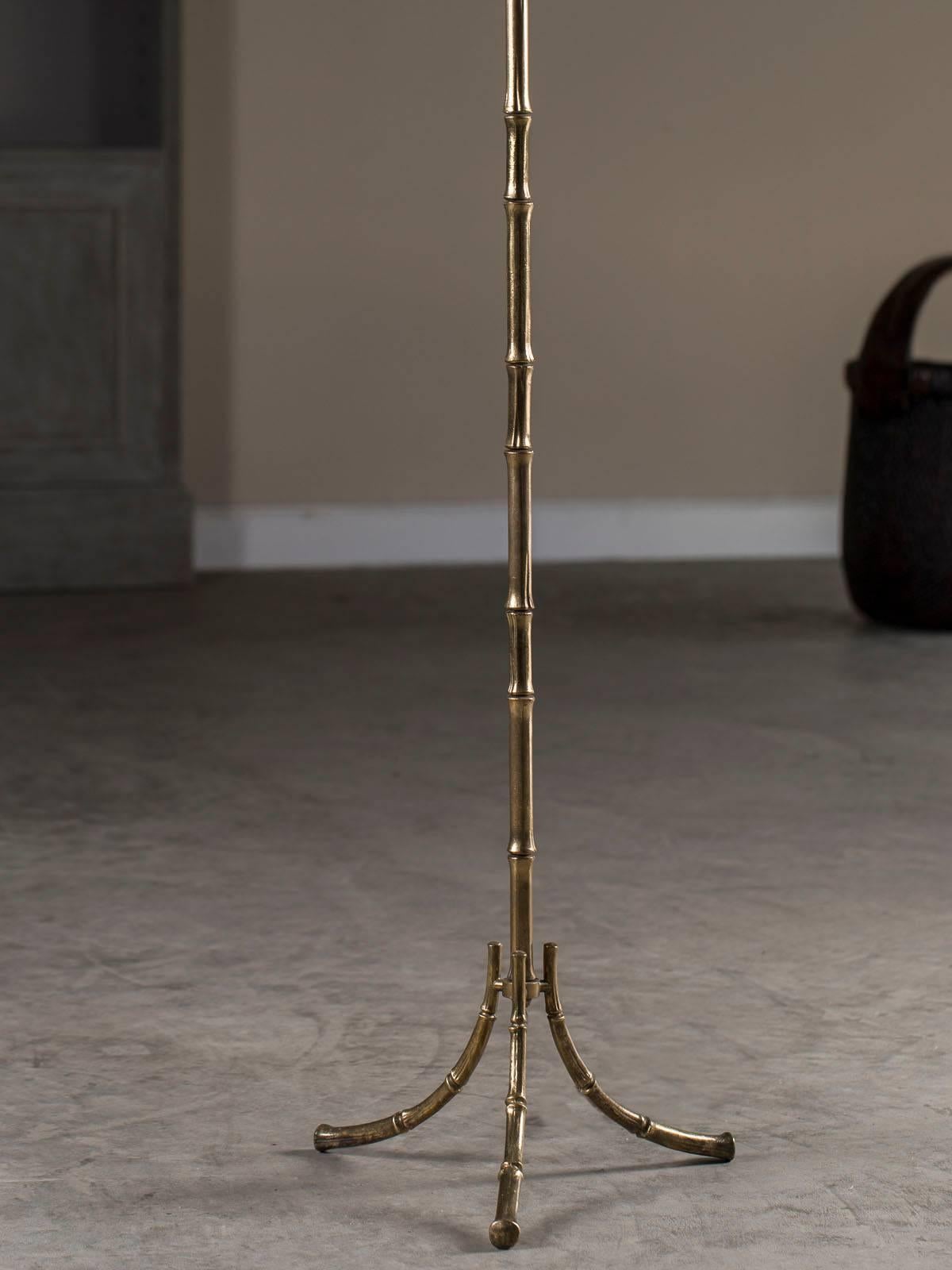 Ah, the classic style of faux bamboo designed by the famous decorating house of Maison Baguès. This elegant vintage French floor lamp, circa 1940, was a staple of interior design in fine French homes as the informal charm of bamboo was translated