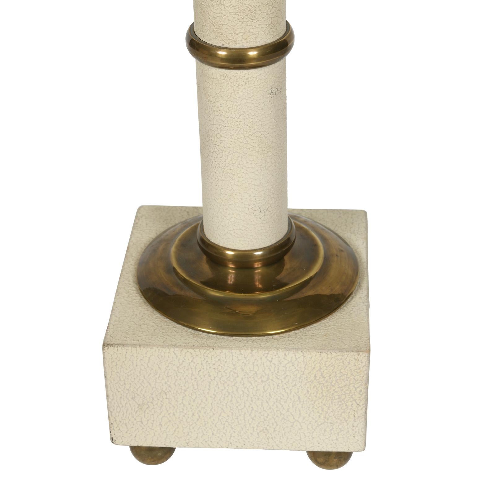 Vintage Maison Charles ivory palm motif lamp with brass details, square base sits on four round brass feet. Measures 26