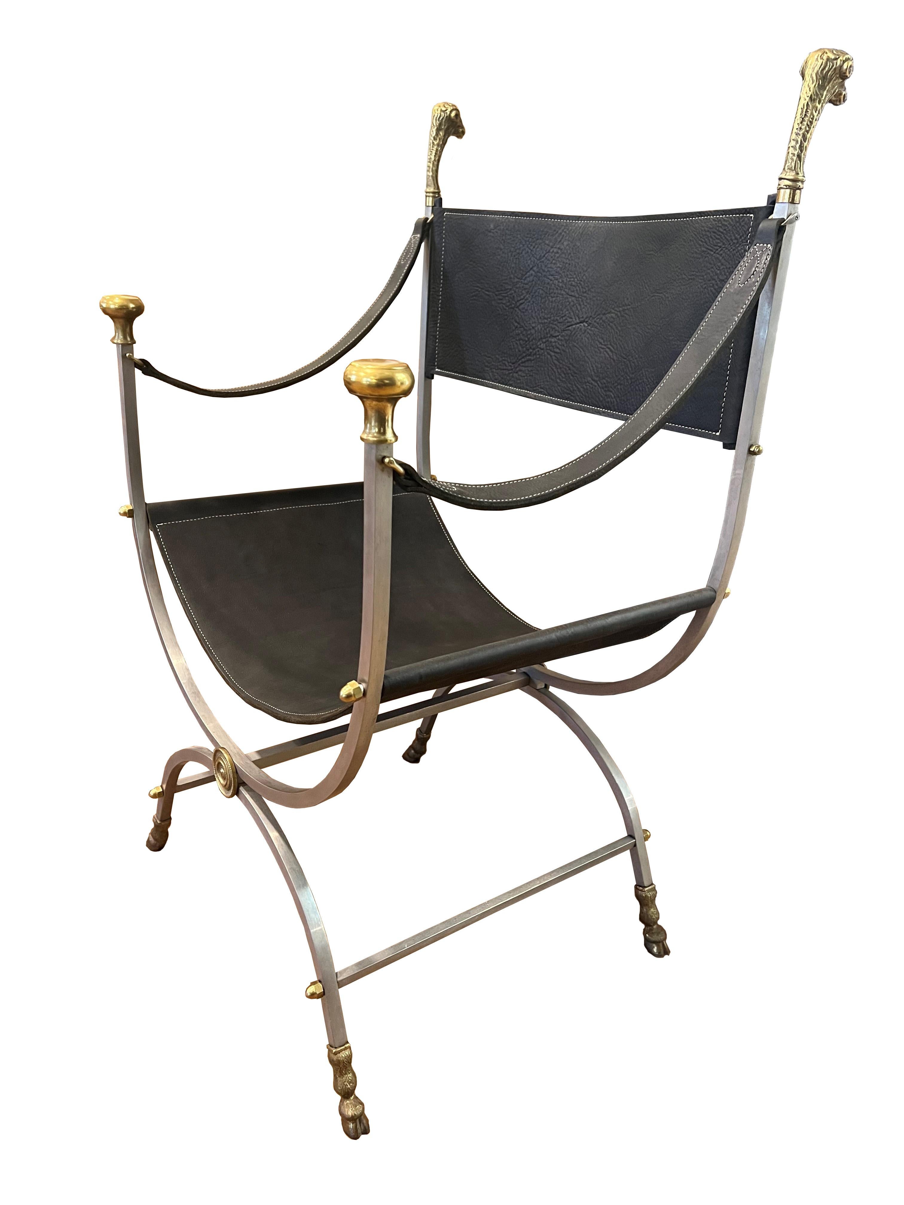 Beautiful Vintage Maison Jansen savonarola Curule chair. Steel frame with brass ram's head accents & feet. Leather seat, back, & arms with contrast stitch. circa 1960s, France.
Re-upholstered with new leather. Steel & brass frame was professionally