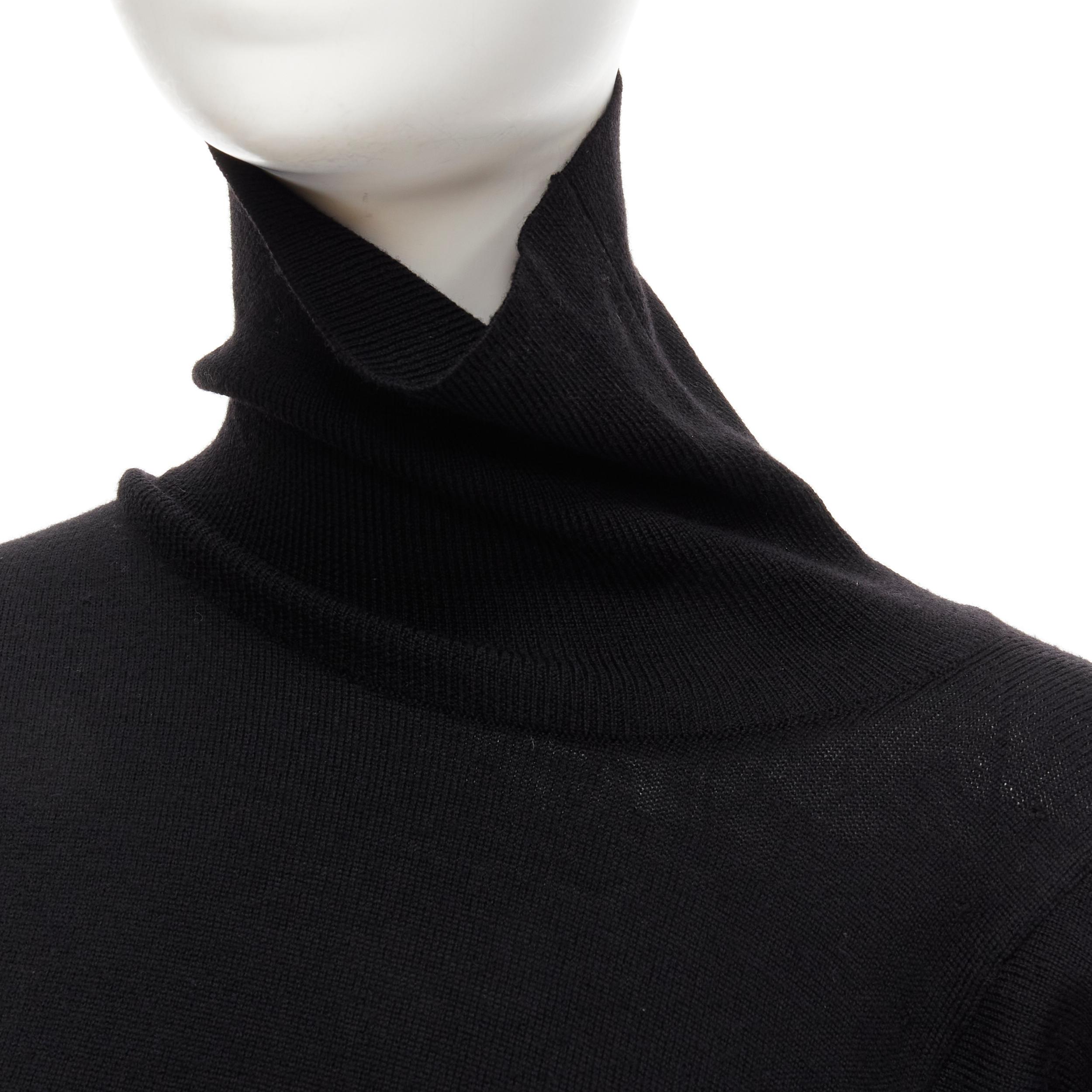 vintage MAISON MARGIELA black wool asymmetric cut pulled turtleneck sweater M 
Reference: LNKO/A01866 
Brand: Maison Margiela 
Material: Wool 
Color: Black 
Pattern: Solid 
Extra Detail: Asymmetric cut to look like the turtleneck is pulled to one