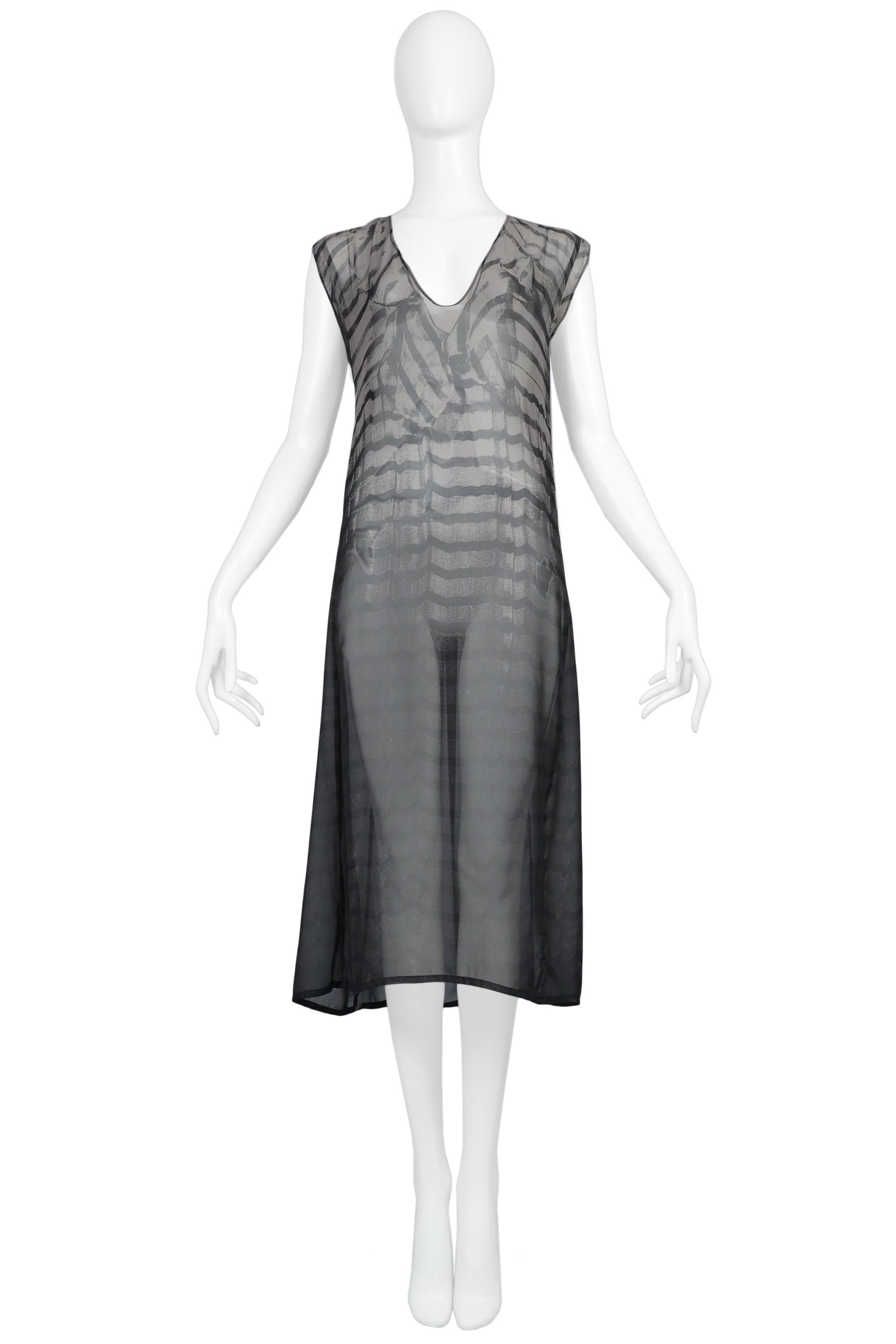 Resurrection Vintage is excited to offer a rare vintage Maison Martin Margiela grey and black striped trompe l'oeil dress print dress featuring a v neck, front and back photo print, and easy body. 

Maison Martin Margiela
One Size 
Sheer Fabric