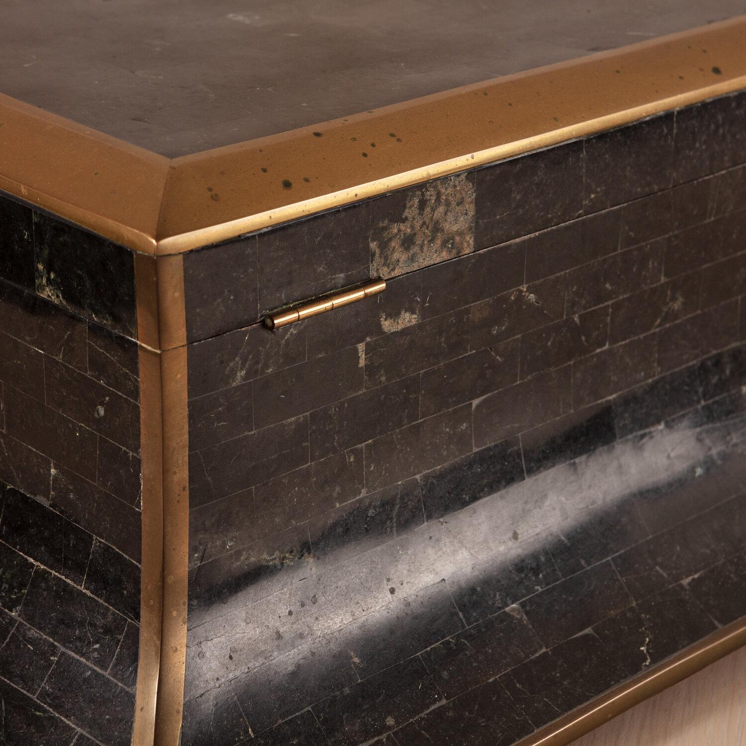 A beautiful Maitland Smith large box with black tessellated stone, brass details and wooden interior.