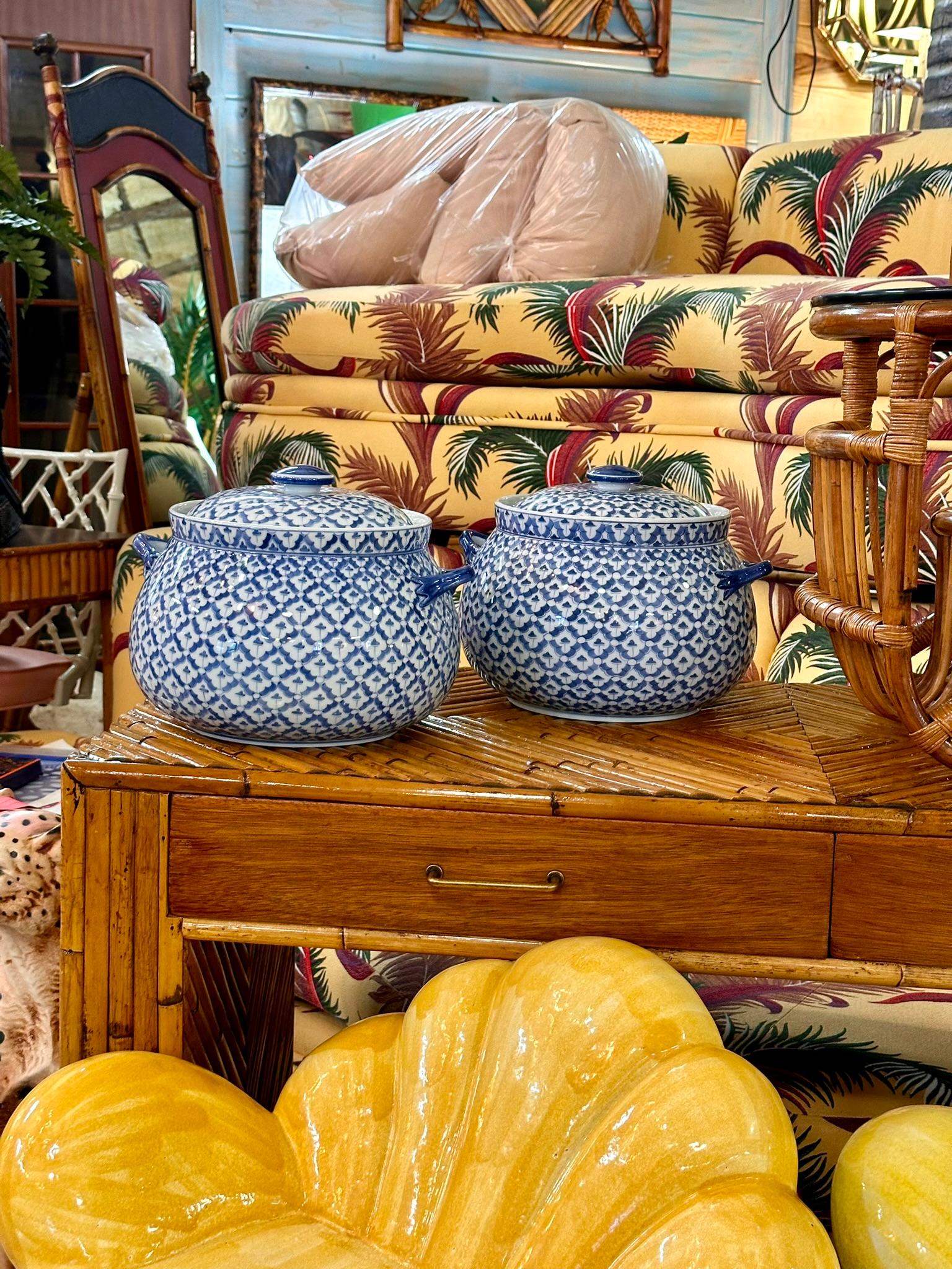 Elevate your dining experience with this exquisite pair of vintage porcelain tureens by the renowned Maitland-Smith.
Each tureen boasts a classic blue and white lattice pattern, meticulously hand-painted to create a timeless and elegant look. The