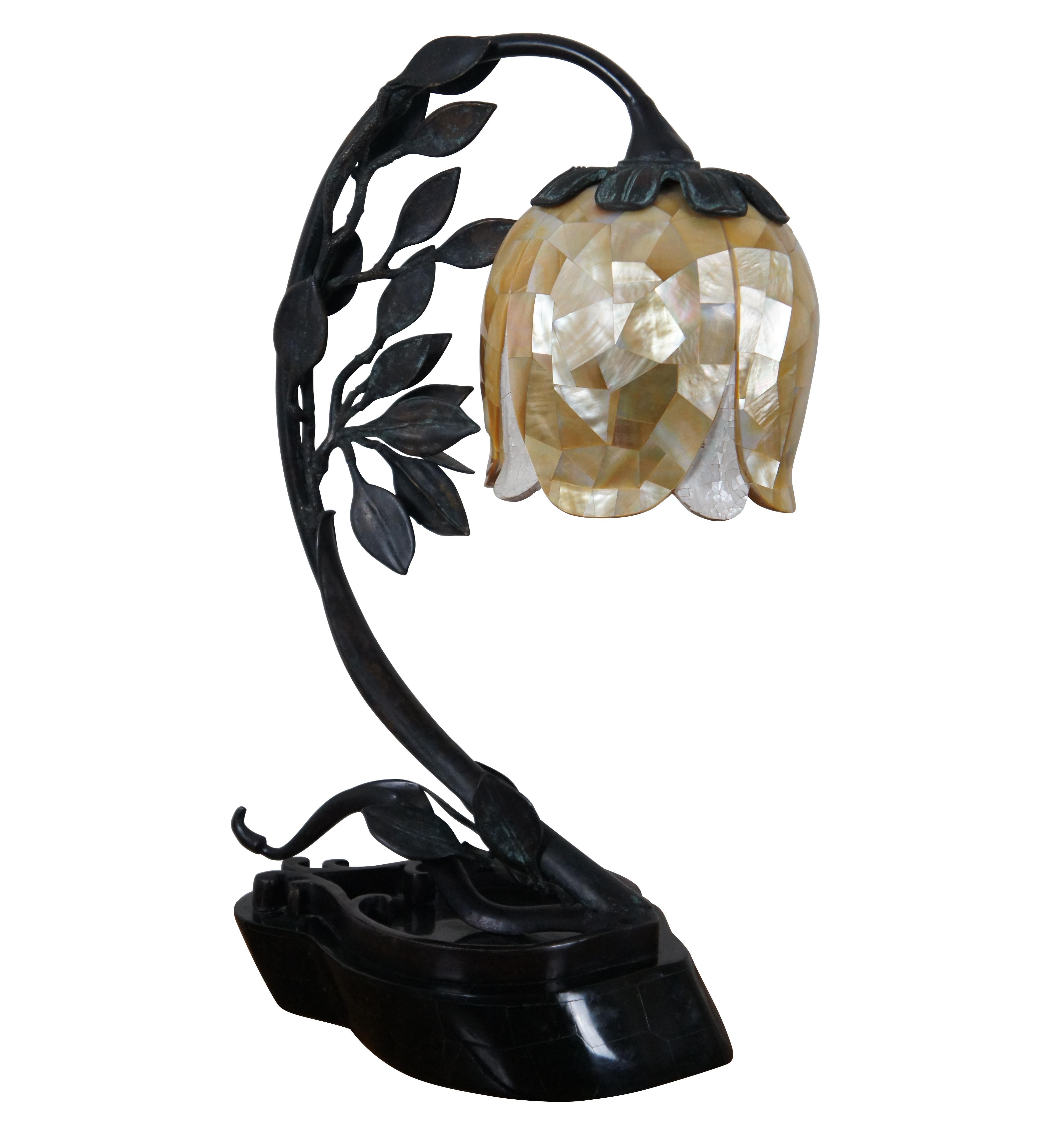 Vintage Maitland Smith Art Deco style table lamp featuring a teardrop shaped, tessellated black marble base supporting a curving bronze stem of a tulip shaped flower in tessellated resin / mother of pearl.